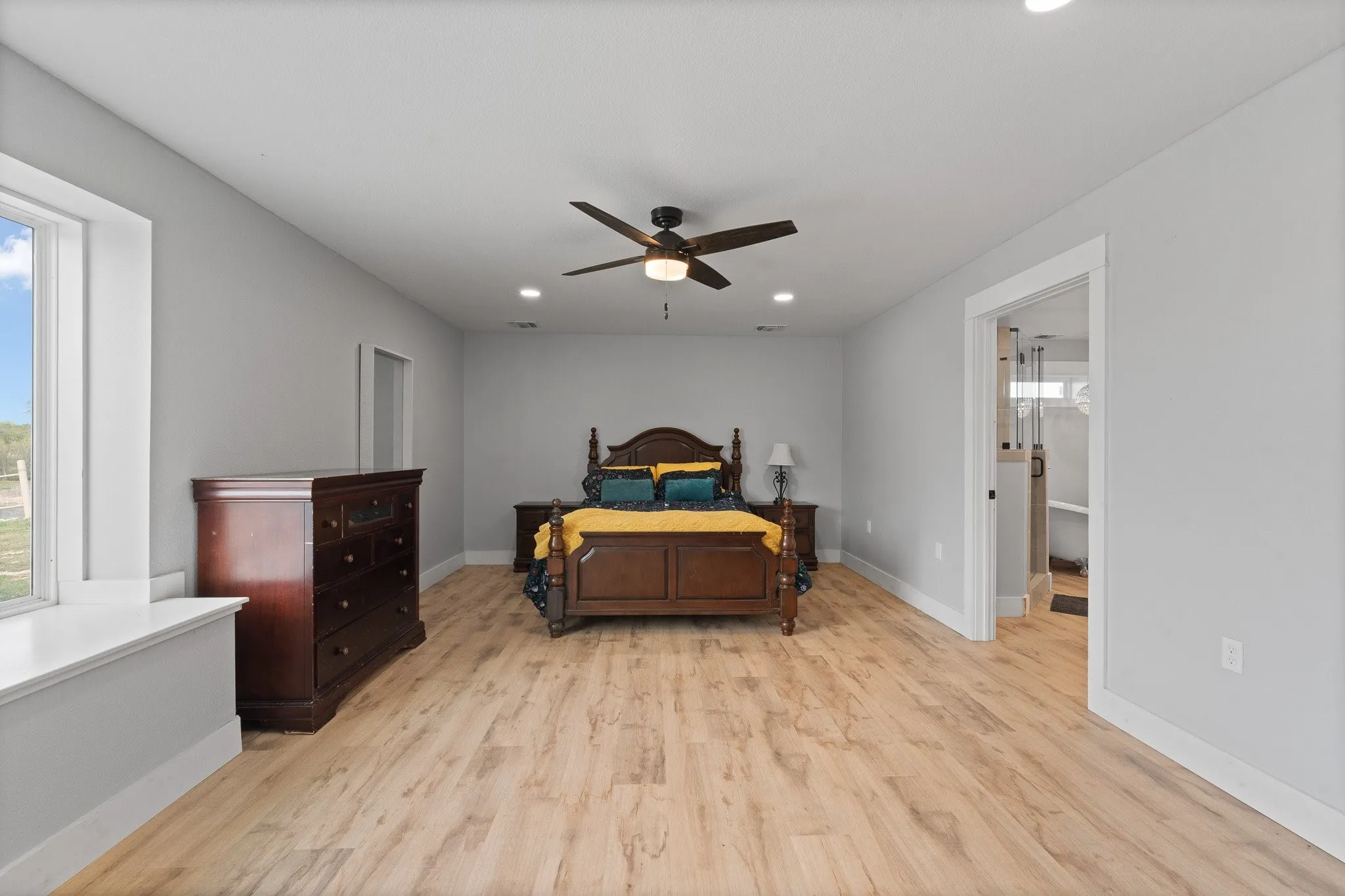 Primary Bathroom with concrete flooring