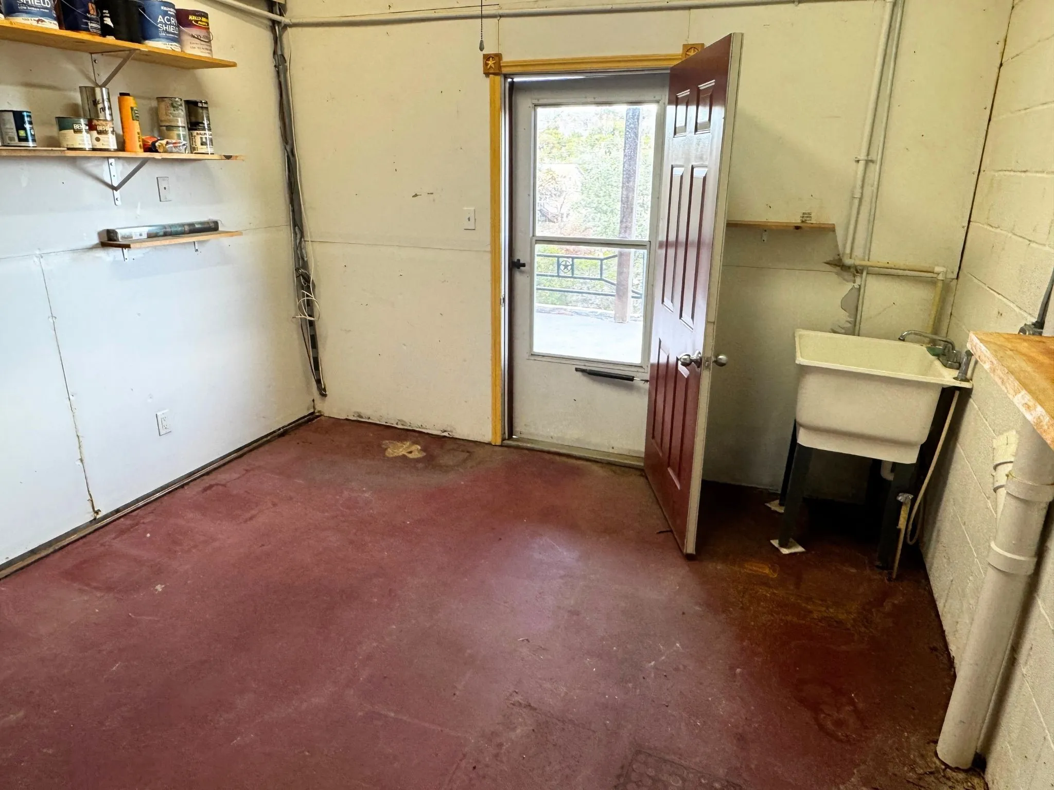 Outdoor storage room on lower level porch. Plumbed for water. Endless potential here!