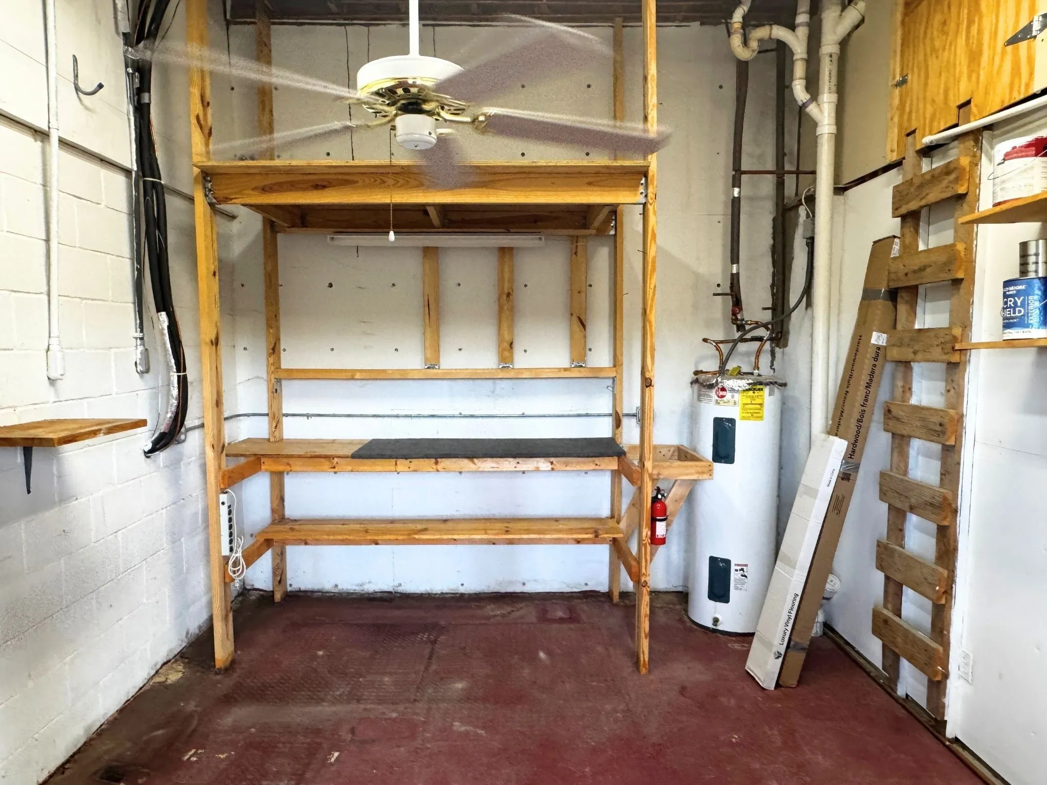 Outdoor storage room on lower level porch. Plumbed for water. Endless potential here!