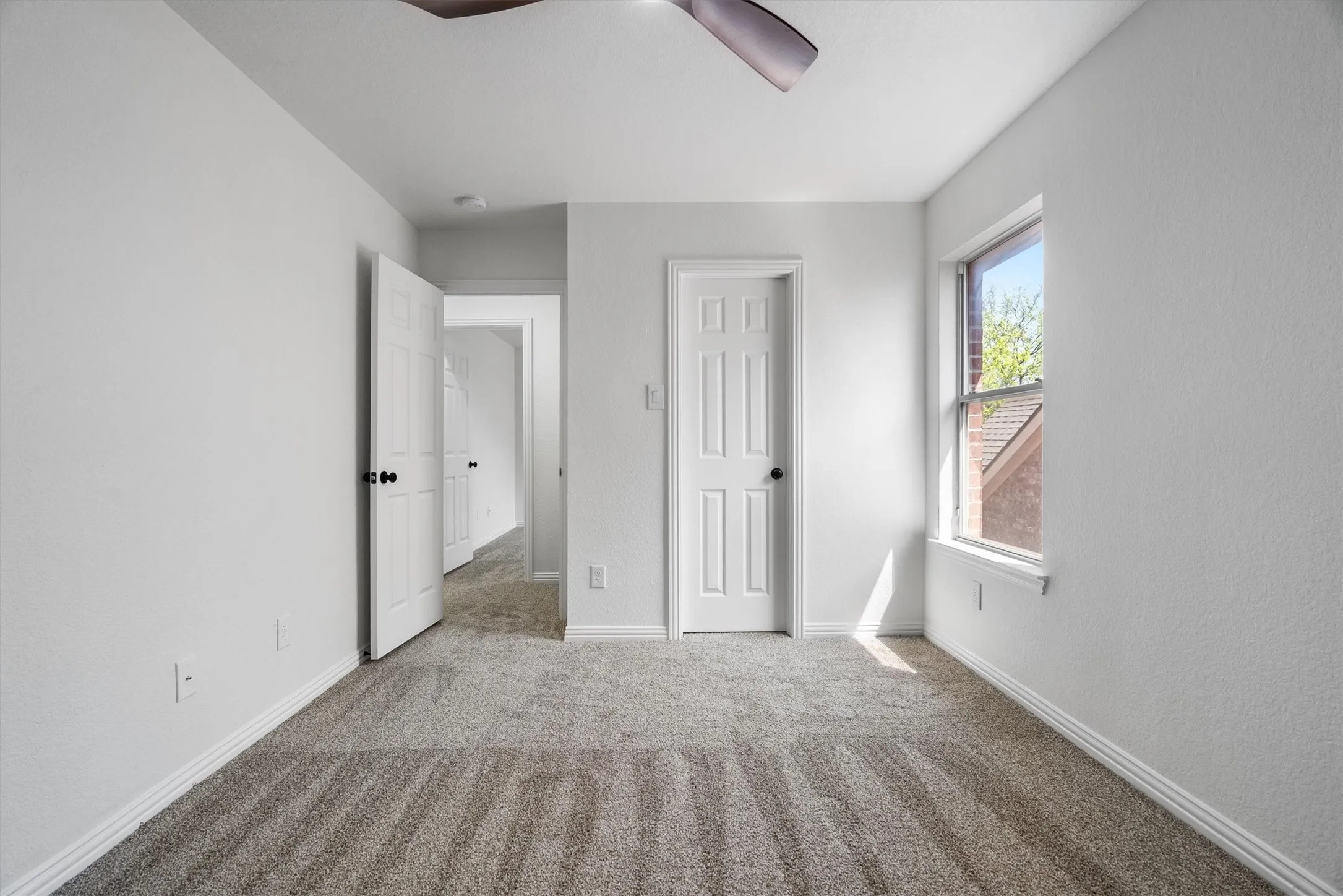 One of three secondary bedrooms, all located on the second floor