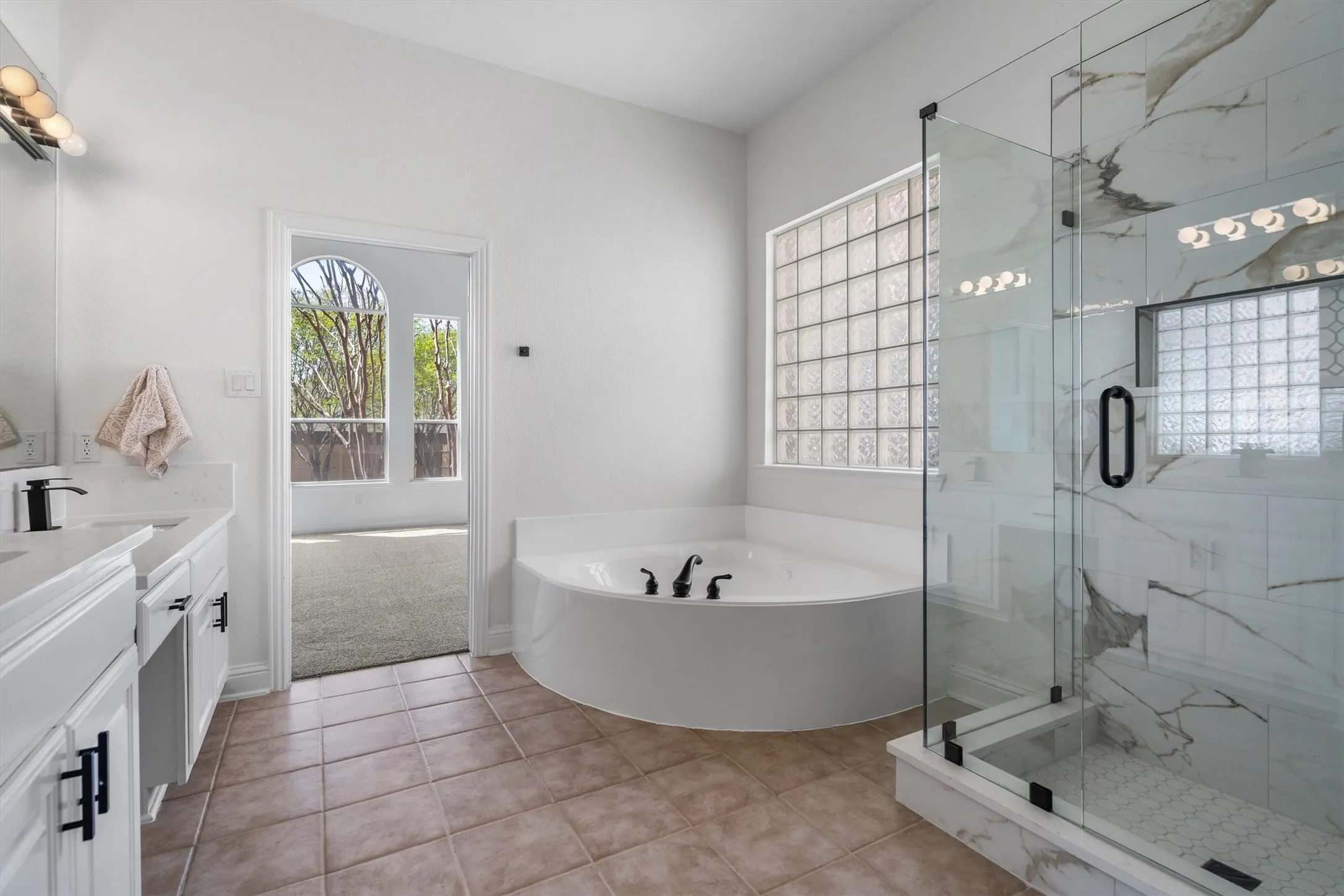 Primary bathroom with all new shower, countertops, faucets, and jetted tub for relaxation