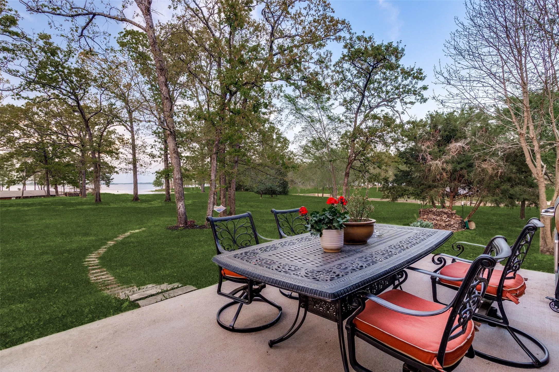 View of patio featuring outdoor dining space and a water view