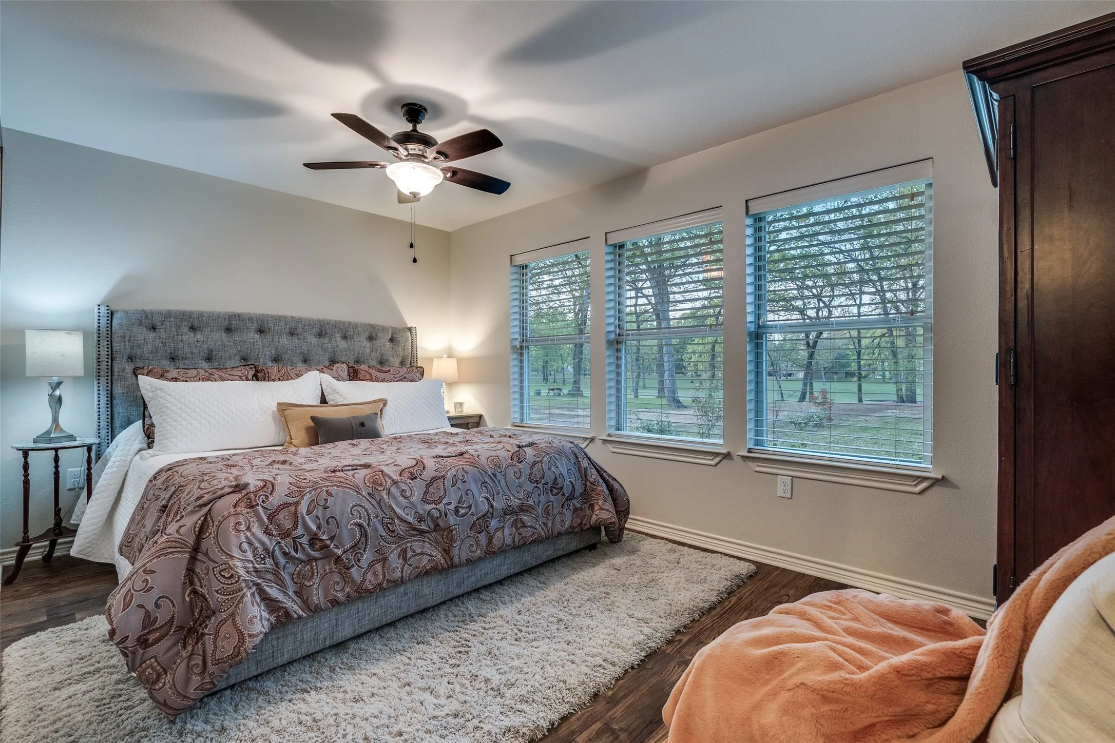 Bedroom featuring dark wood-type flooring and ceiling fan