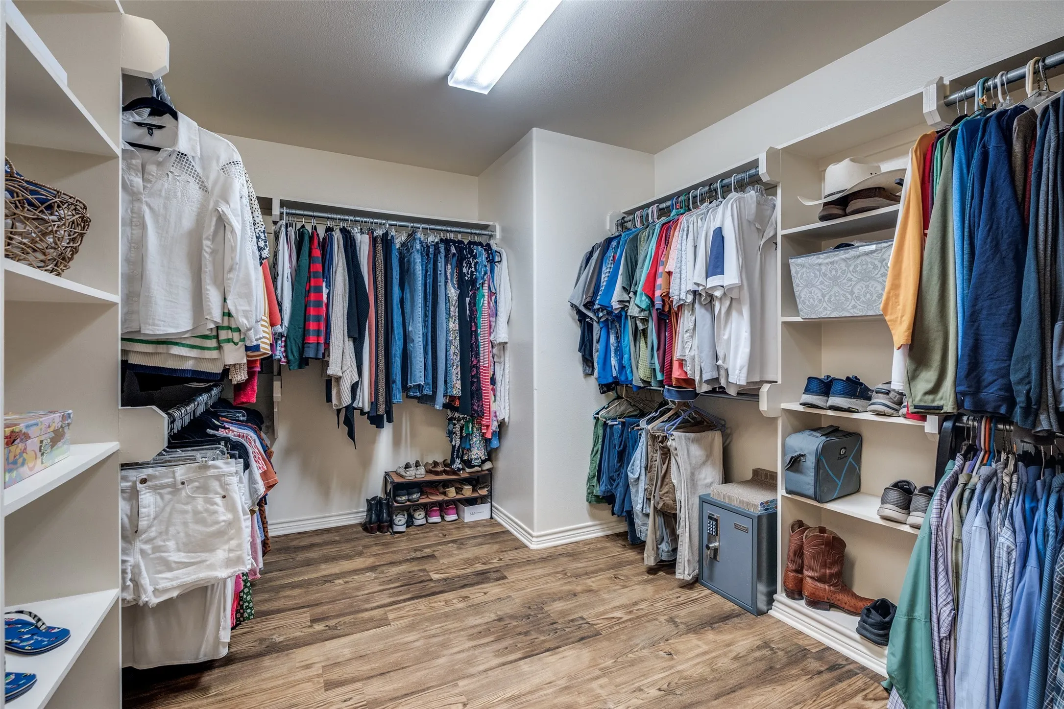 Walk in closet featuring light wood-type flooring