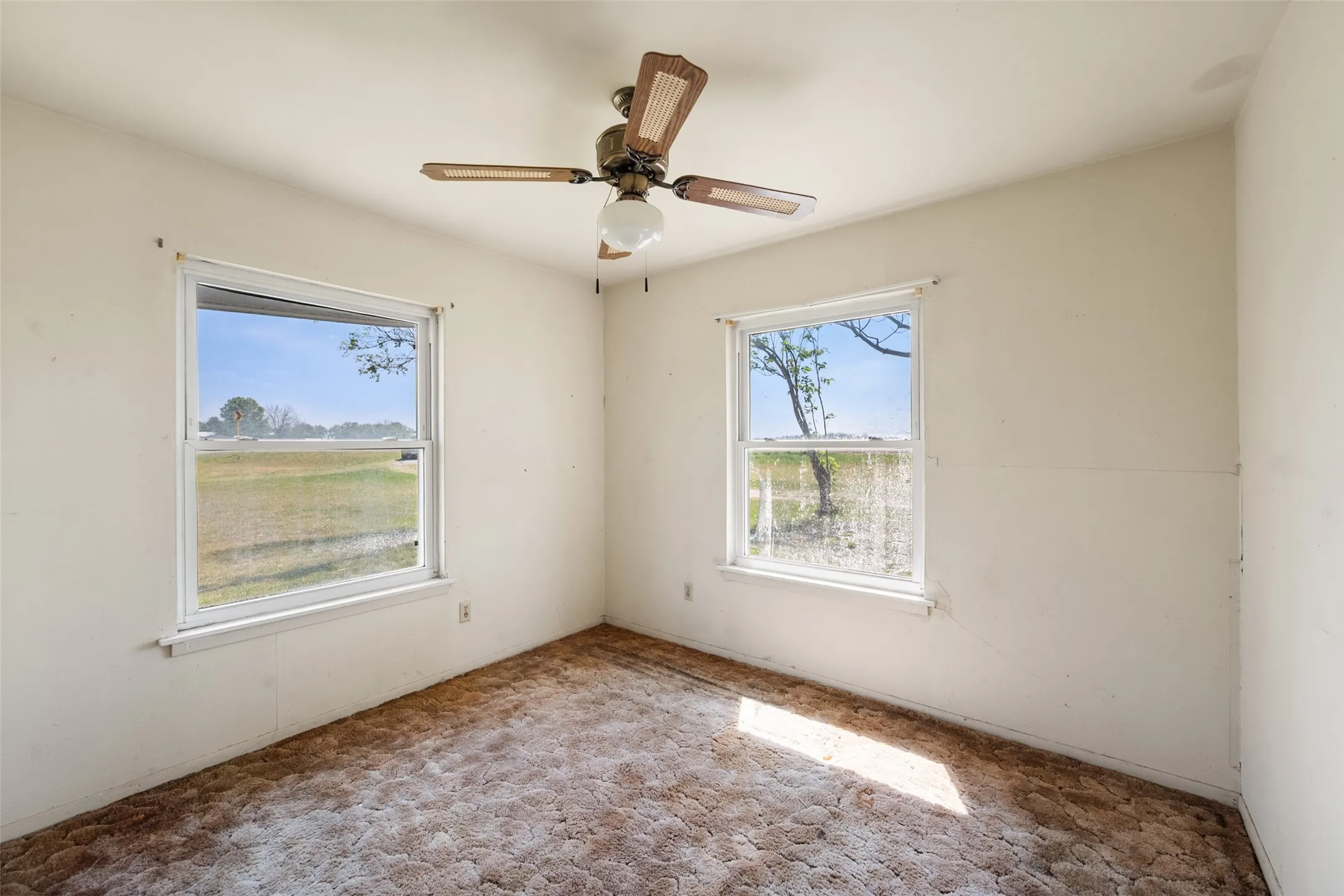 Unfurnished bedroom featuring plenty of natural light