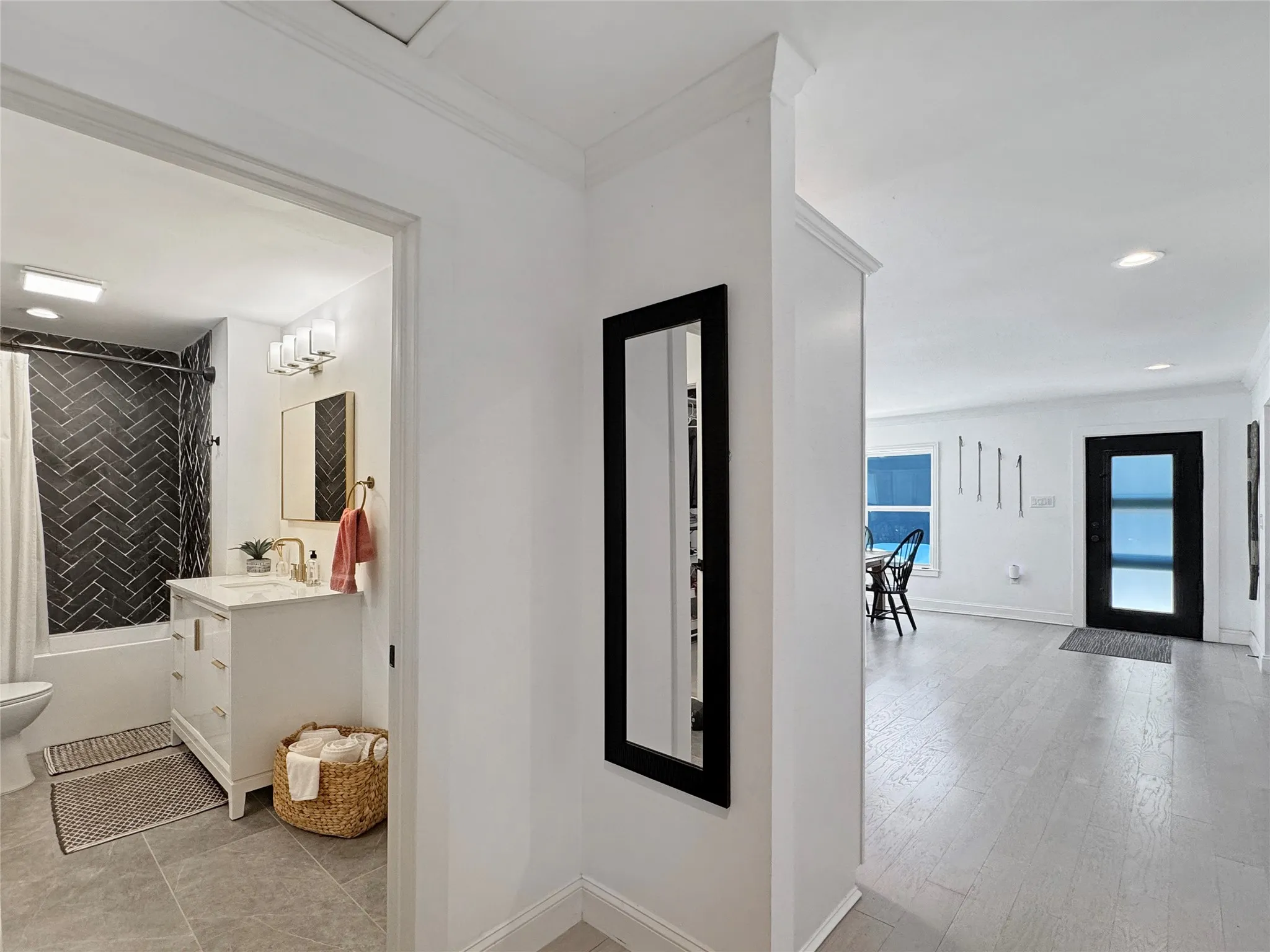 Corridor with recessed lighting and crown molding