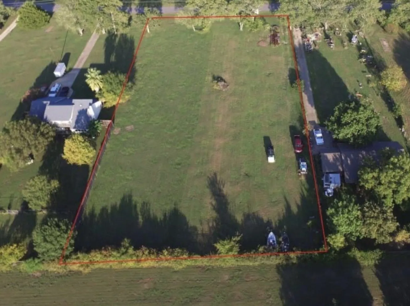 This view is from the lakeside toward the street. Lot 4 is on the left side of photo frame, next-door to the larger home. The right side is Lot 5 and has been SOLD.