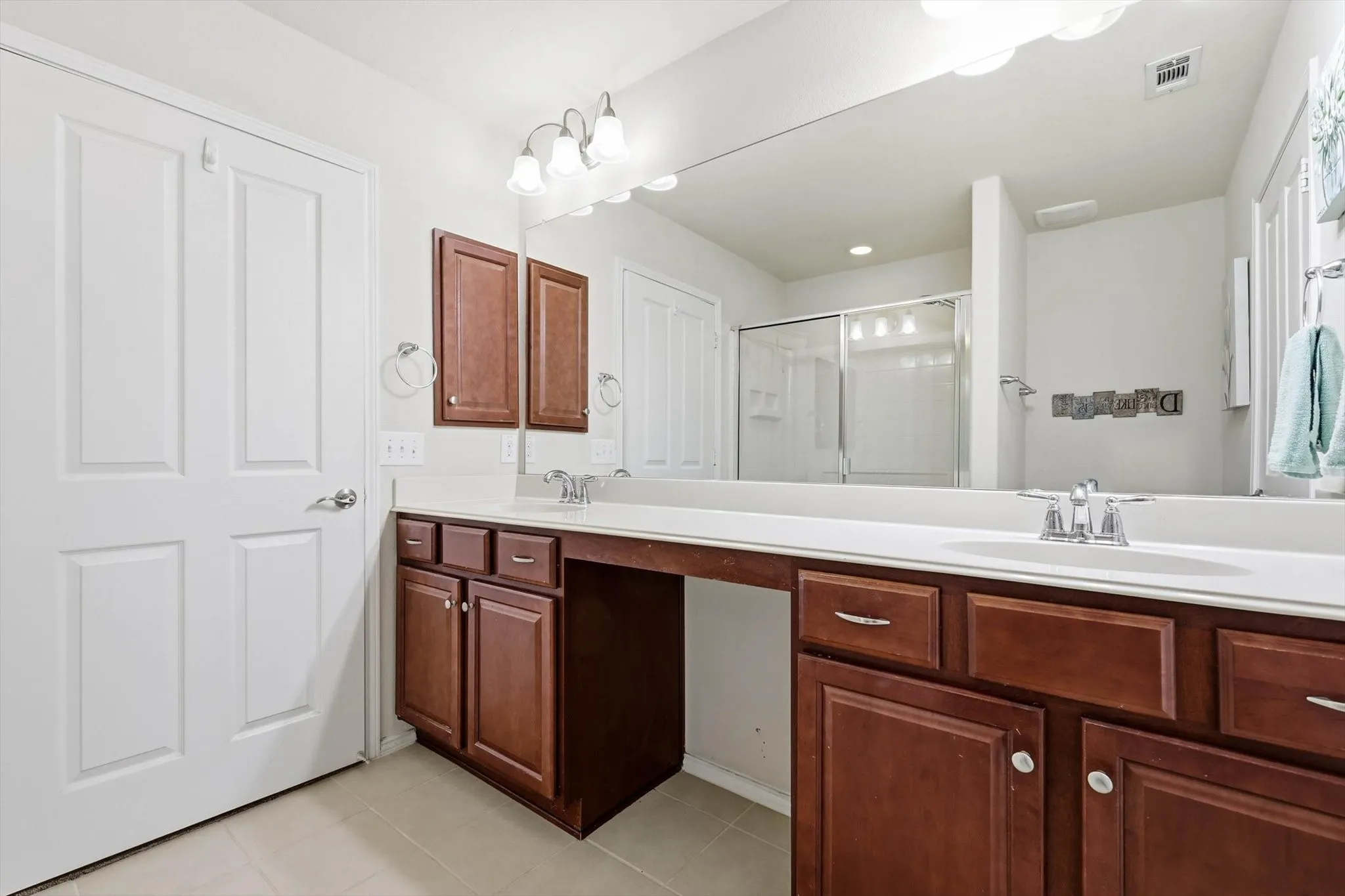 Primary Bathroom has an abundance of cabinets