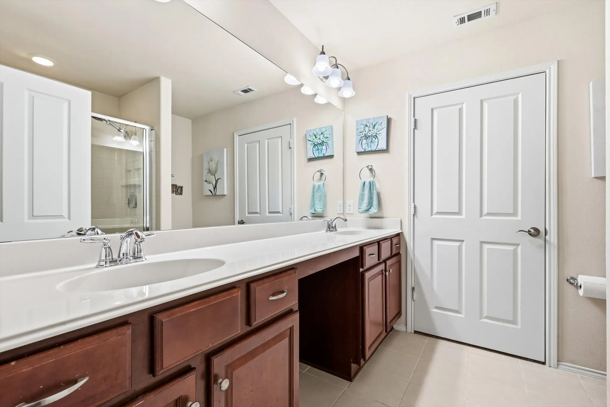Primary Bathroom has dual sinks and a walk in closet