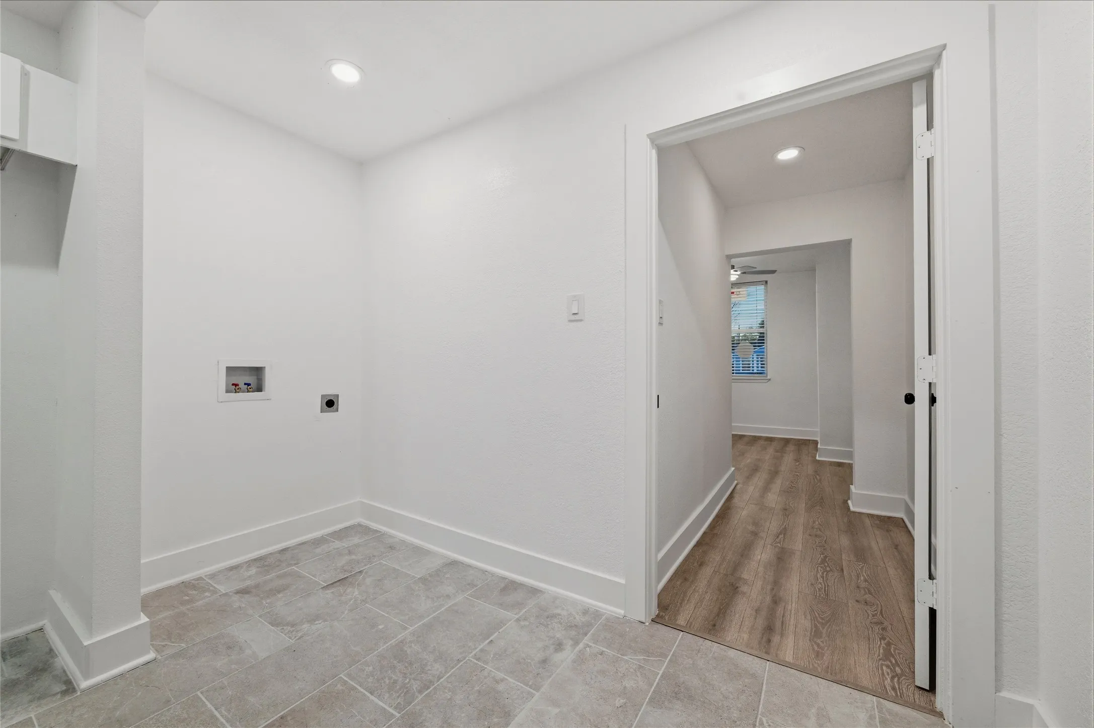 Laundry room with washer hookup, recessed lighting, hookup for an electric dryer, and light tile patterned floors
