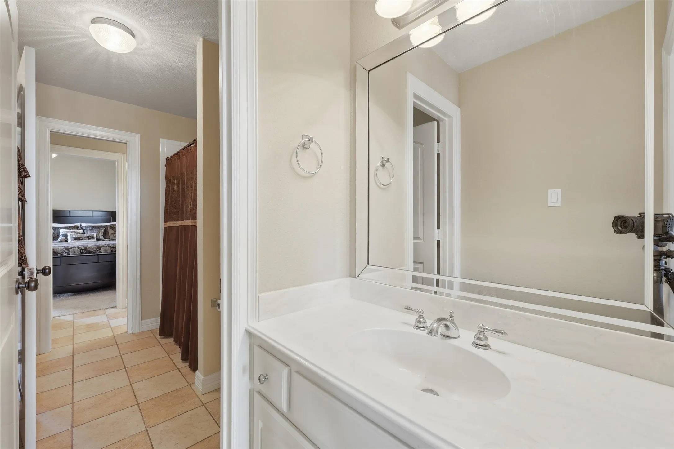 Jack and Jill bath with each bedroom having their own vanity.
