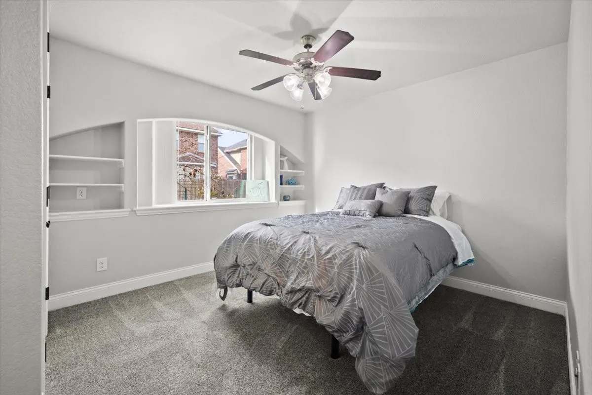 Bedroom with carpet floors and ceiling fan