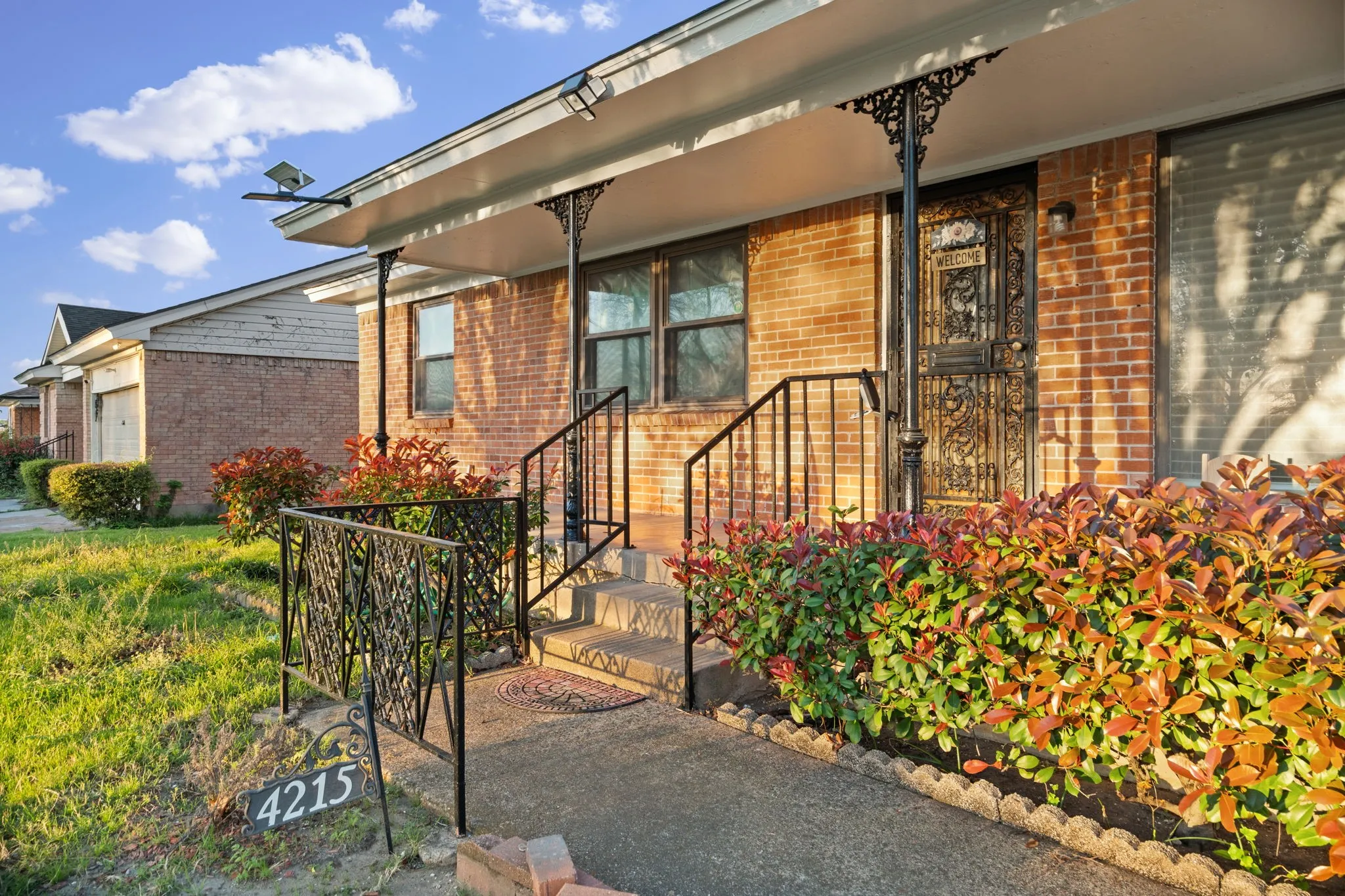 View of exterior entry featuring brick siding