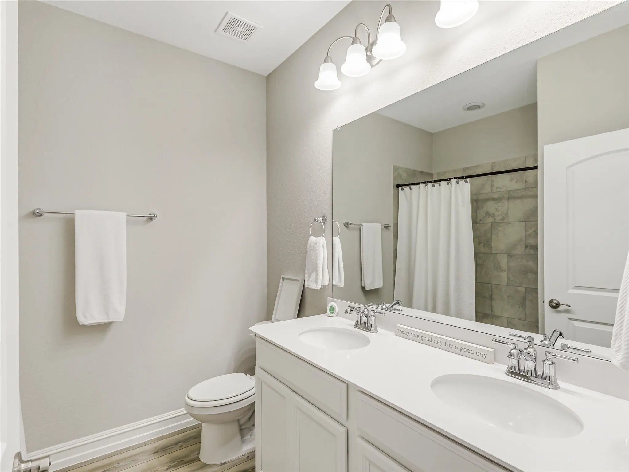Full Bath Located Between the Secondary Bedrooms Features Double Sink Vanity