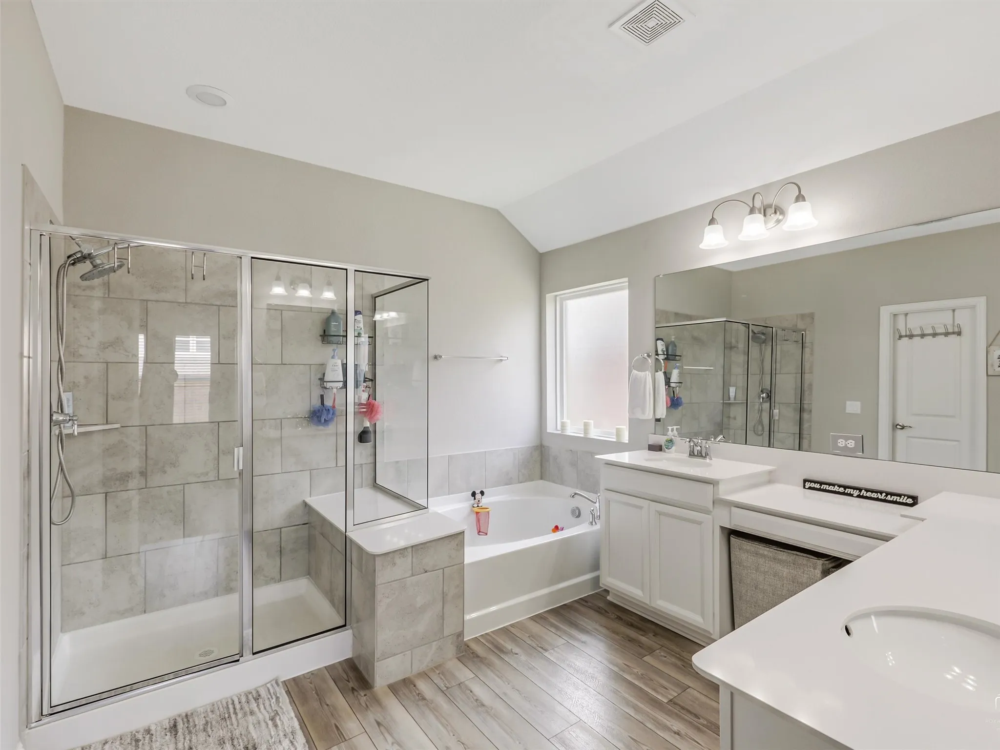 Nicely Appointed Primary Bath with Walk In Shower, Tub, and Double Vanities and Make Up Space!