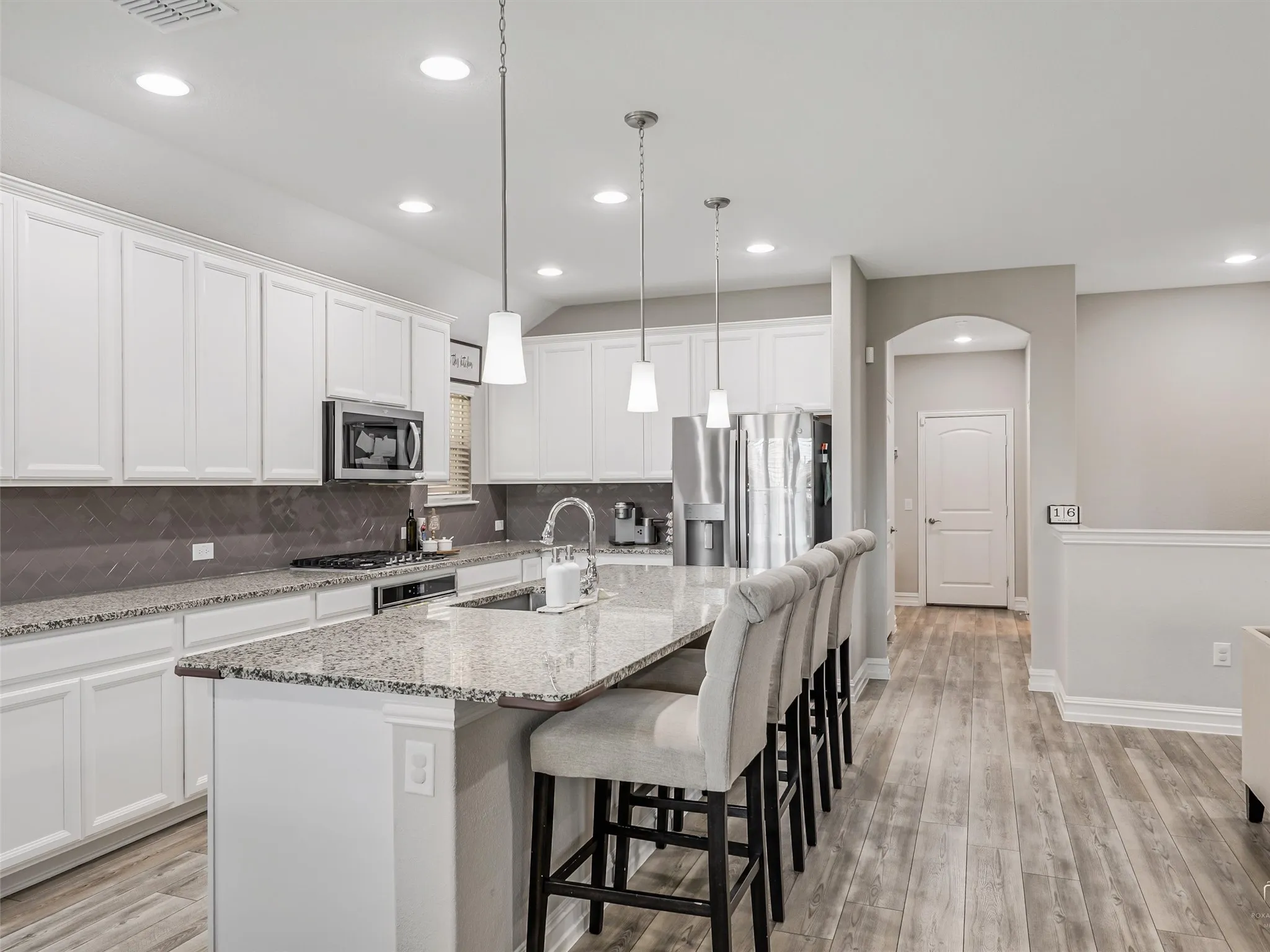 Bright and Open Kitchen Concept with Farm Sink and Gas Burners.