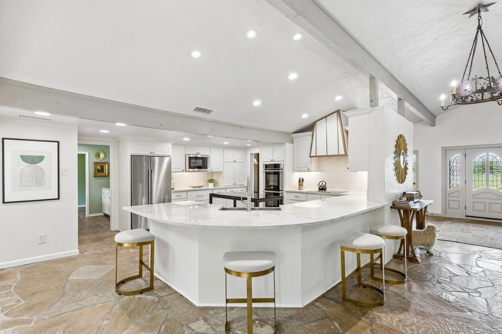 Recently renovated kitchen with Taj Mahal countertops, new cabinets and appliances.