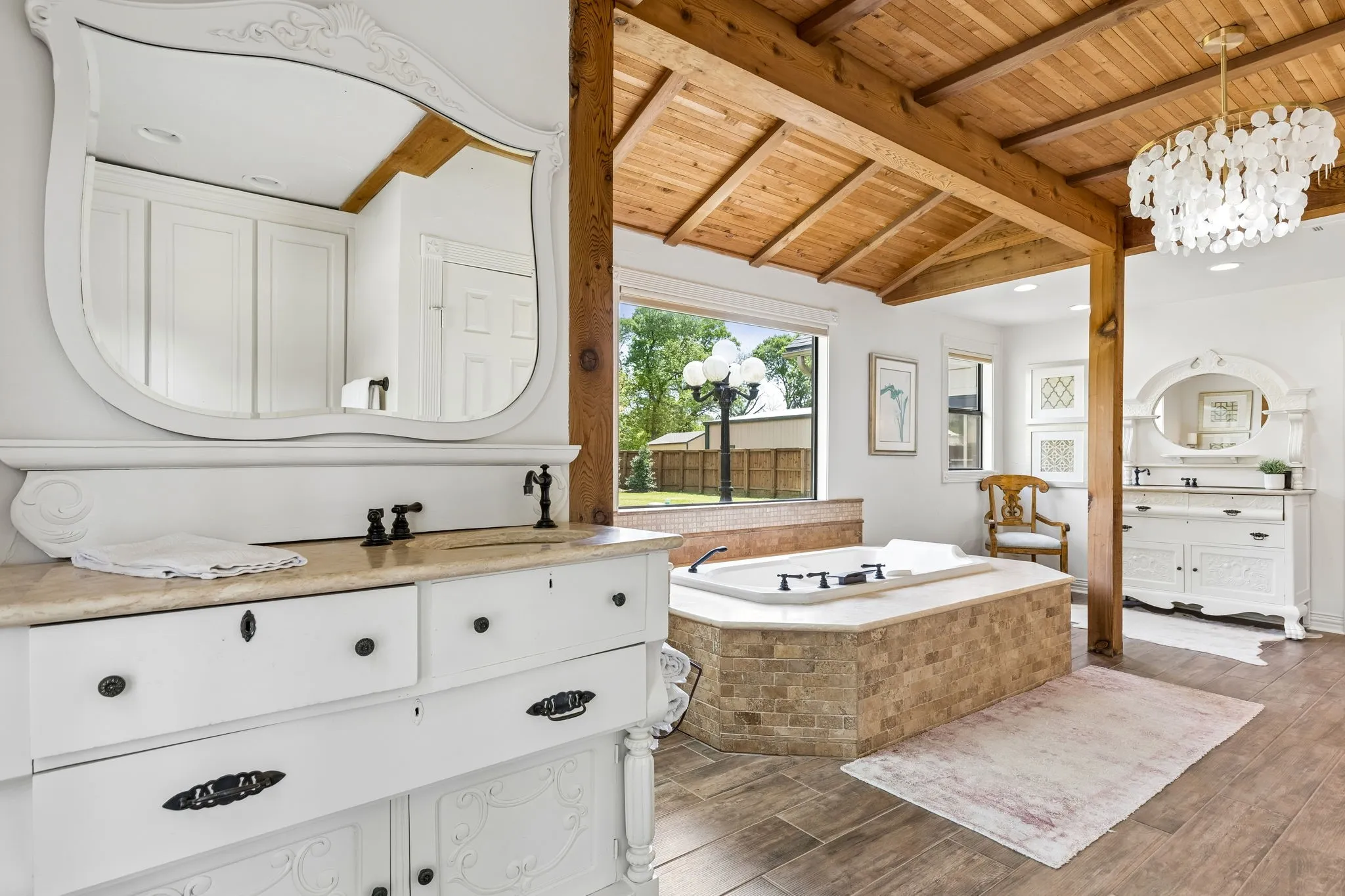 Tastefully updated master bath with separate walk-in his and her closets and YES ! 2 separate private water closets so no more waiting for the bathroom!   This room is just stunning!