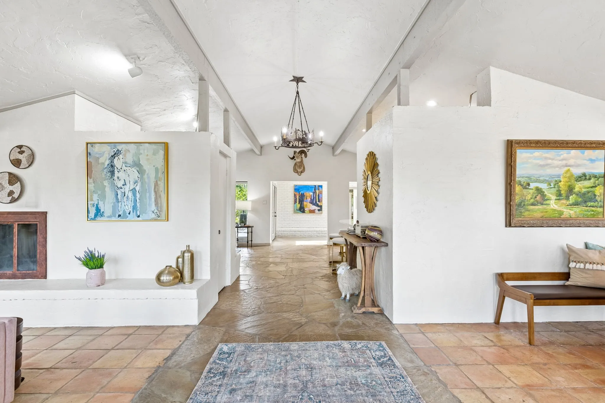 Flagstone entry with beamed ceiling opens to bright and recently renovated living space