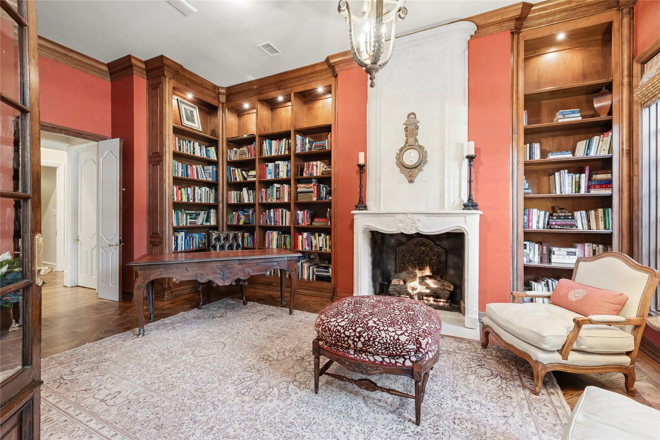 Office space with custom imported limestone fireplace and wooden doors imported from old post office