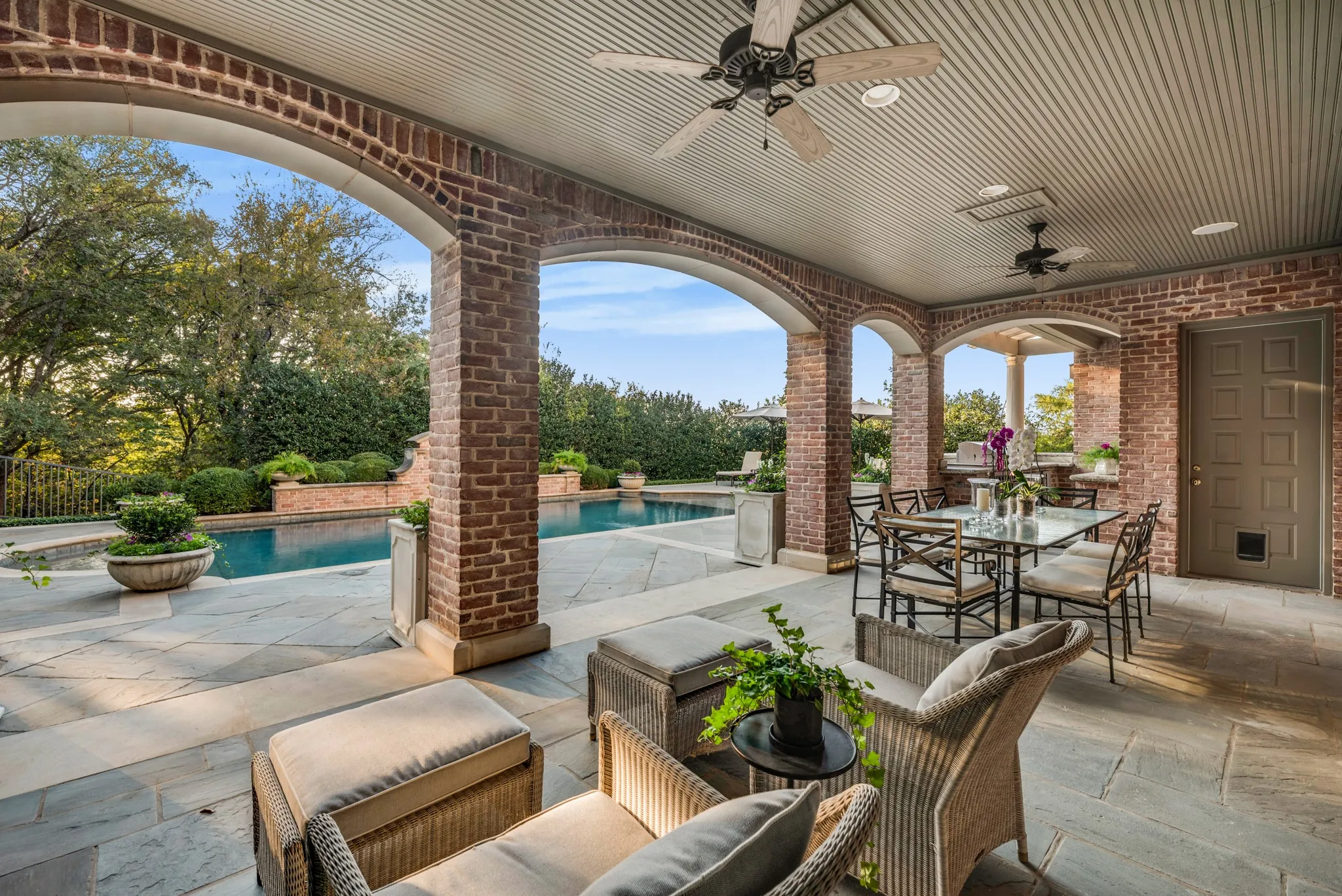 Outdoor living area with access to lower level and outdoor grill