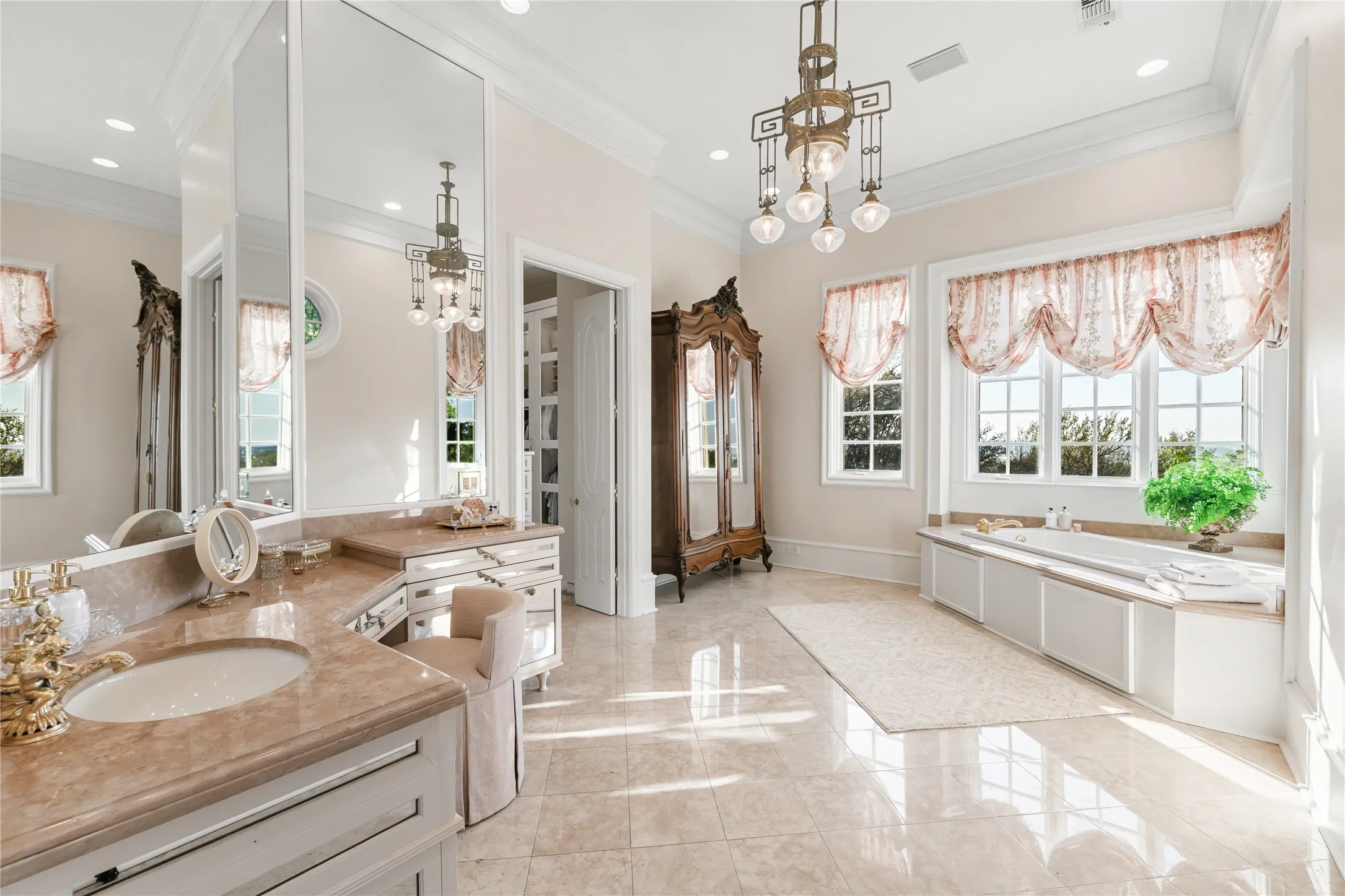 Pink marble primary bathroom overlooking Lake Viridian