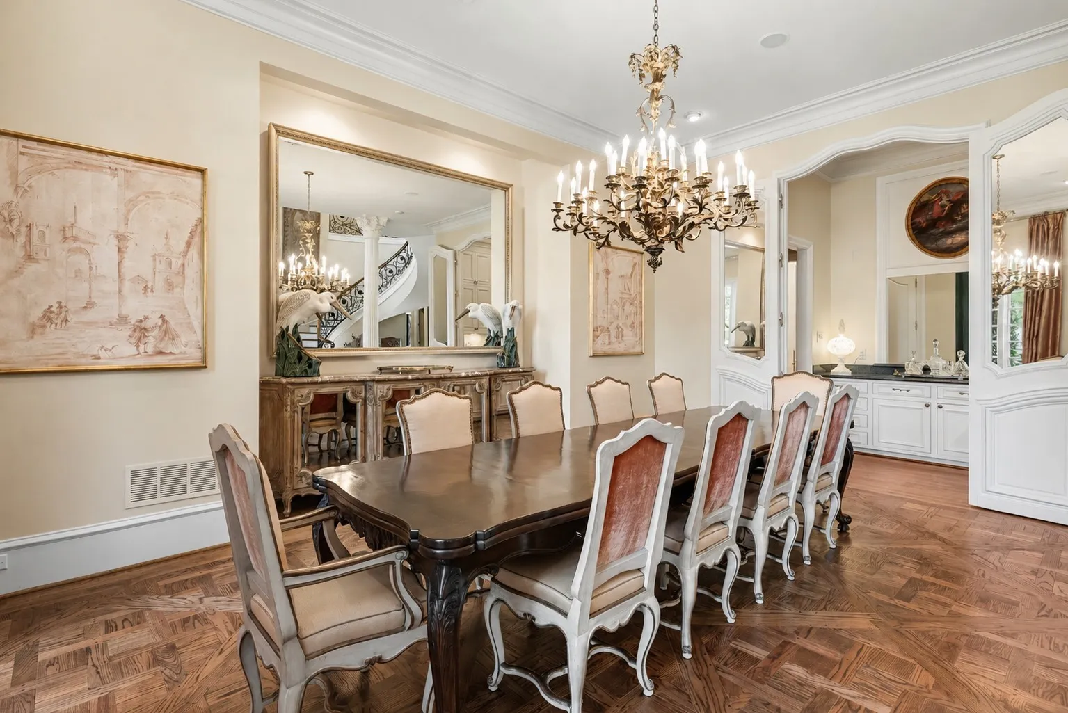 Front entry formal dining area with wet bar connecting to kitchen