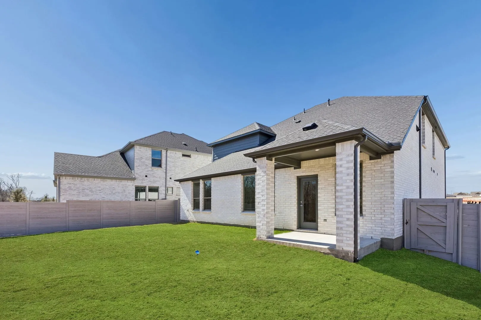 Covered Patio in the Masters home plan by Trophy Signature Homes – REPRESENTATIVE PHOTO