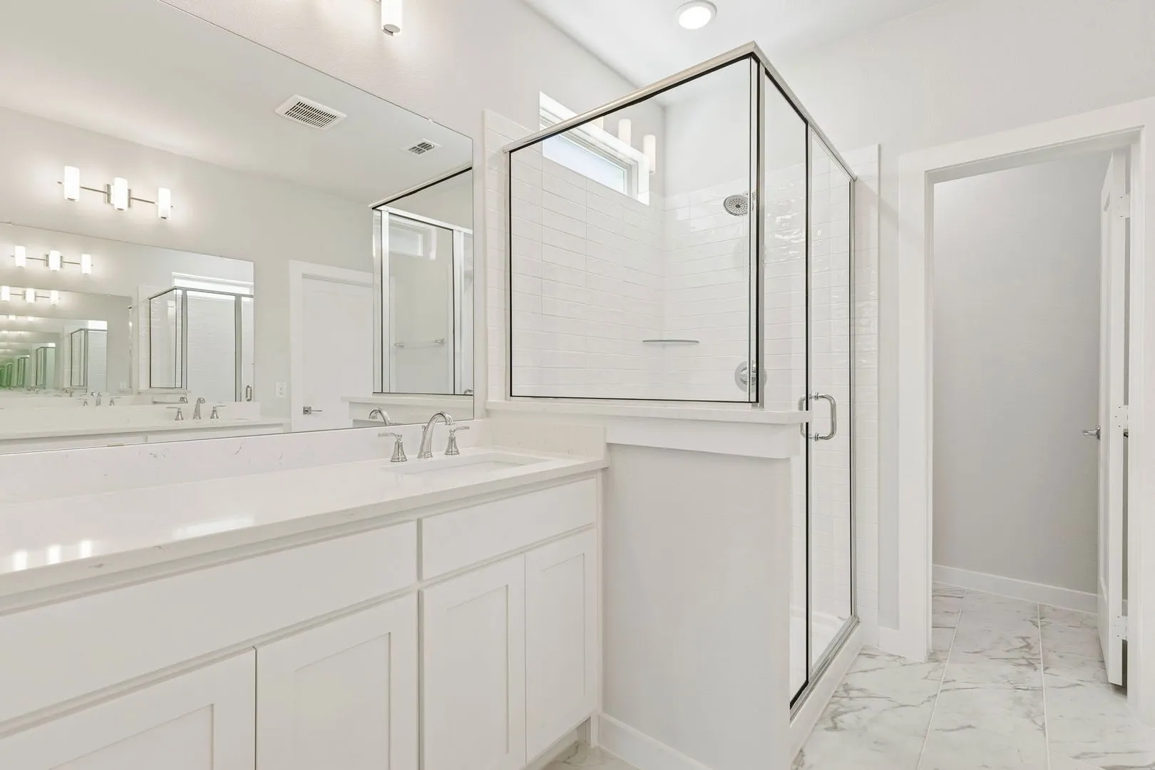 Primary Bathroom in the Masters home plan by Trophy Signature Homes – REPRESENTATIVE PHOTO