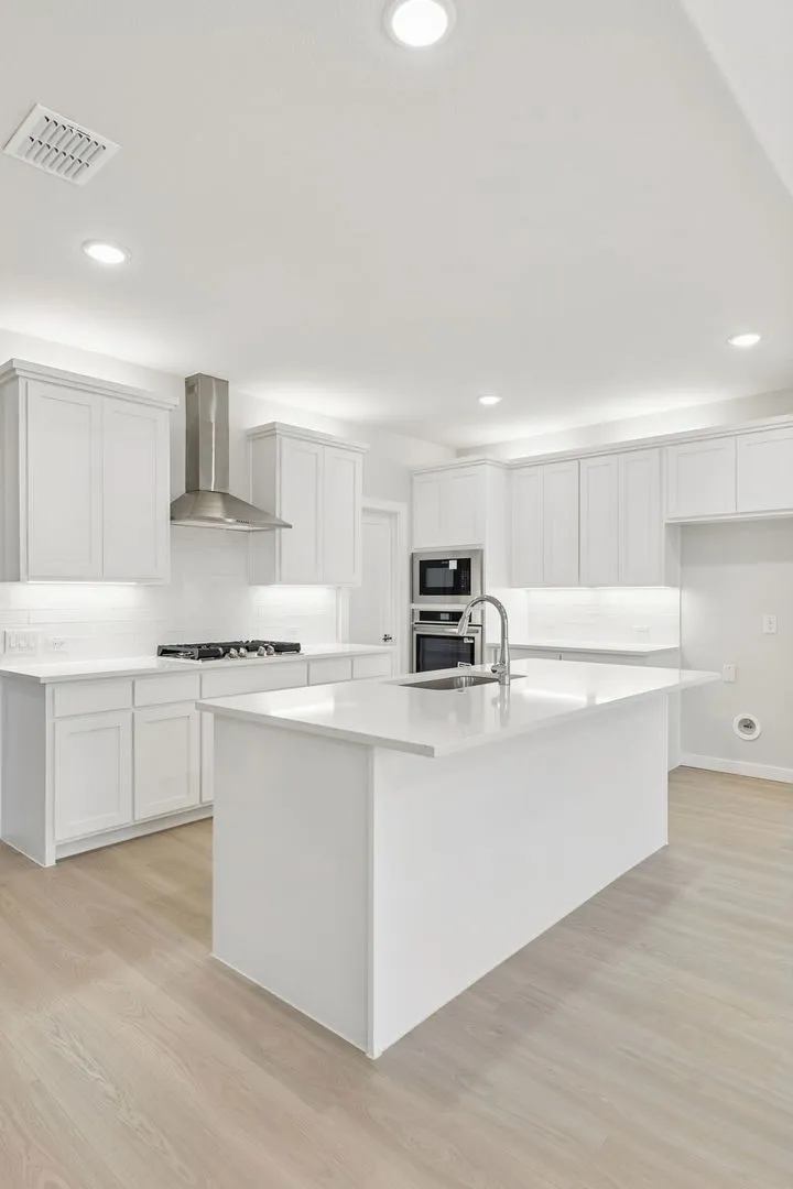 Kitchen in the Masters home plan by Trophy Signature Homes – REPRESENTATIVE PHOTO