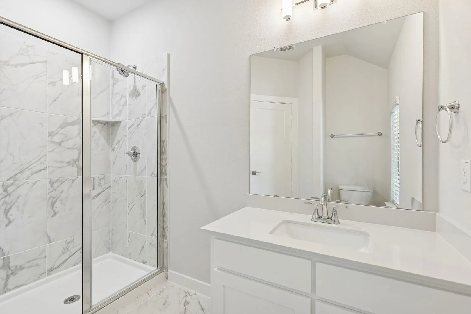 Bathroom in the Masters home plan by Trophy Signature Homes – REPRESENTATIVE PHOTO