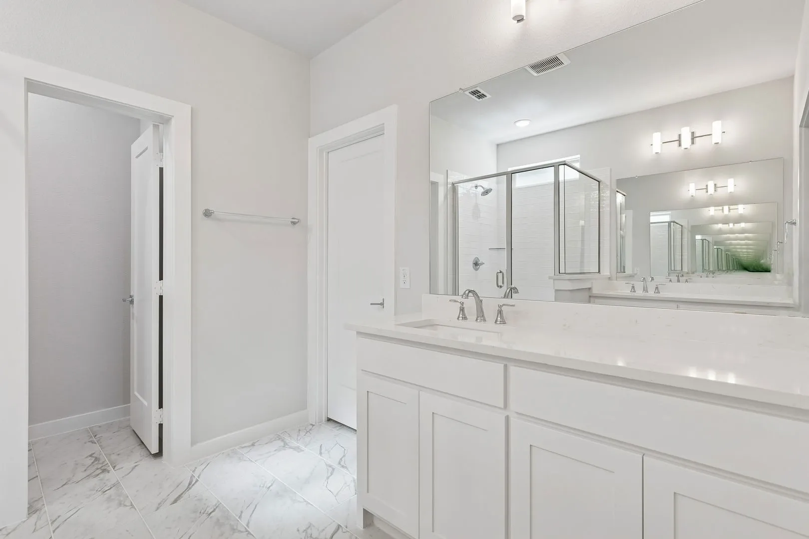 Primary Bathroom in the Masters home plan by Trophy Signature Homes – REPRESENTATIVE PHOTO