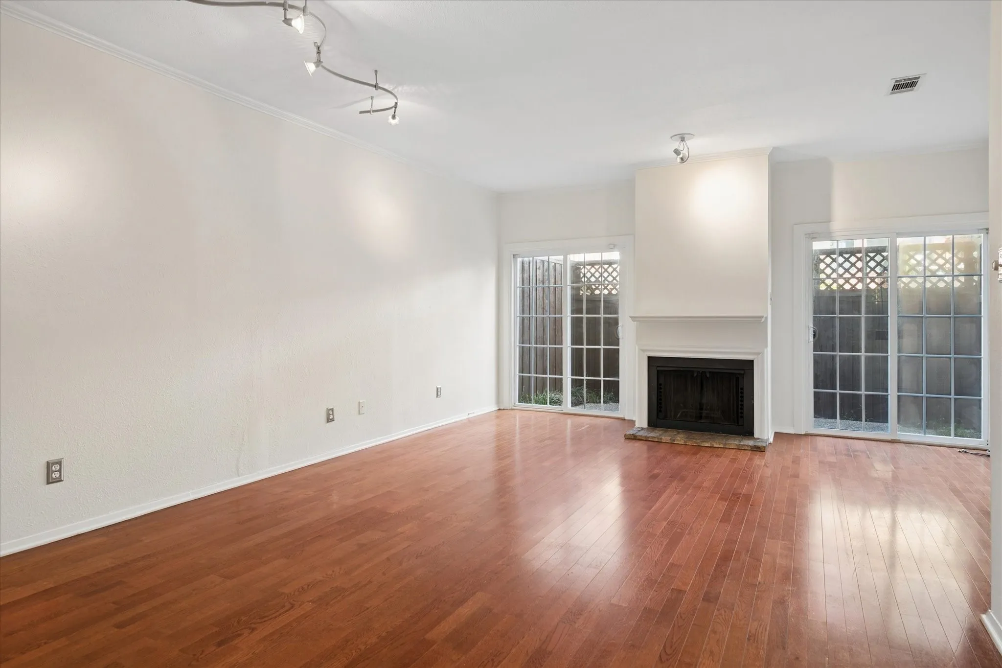 Living Room With Fireplace And Direct Access To Your Private Enclosed Patio