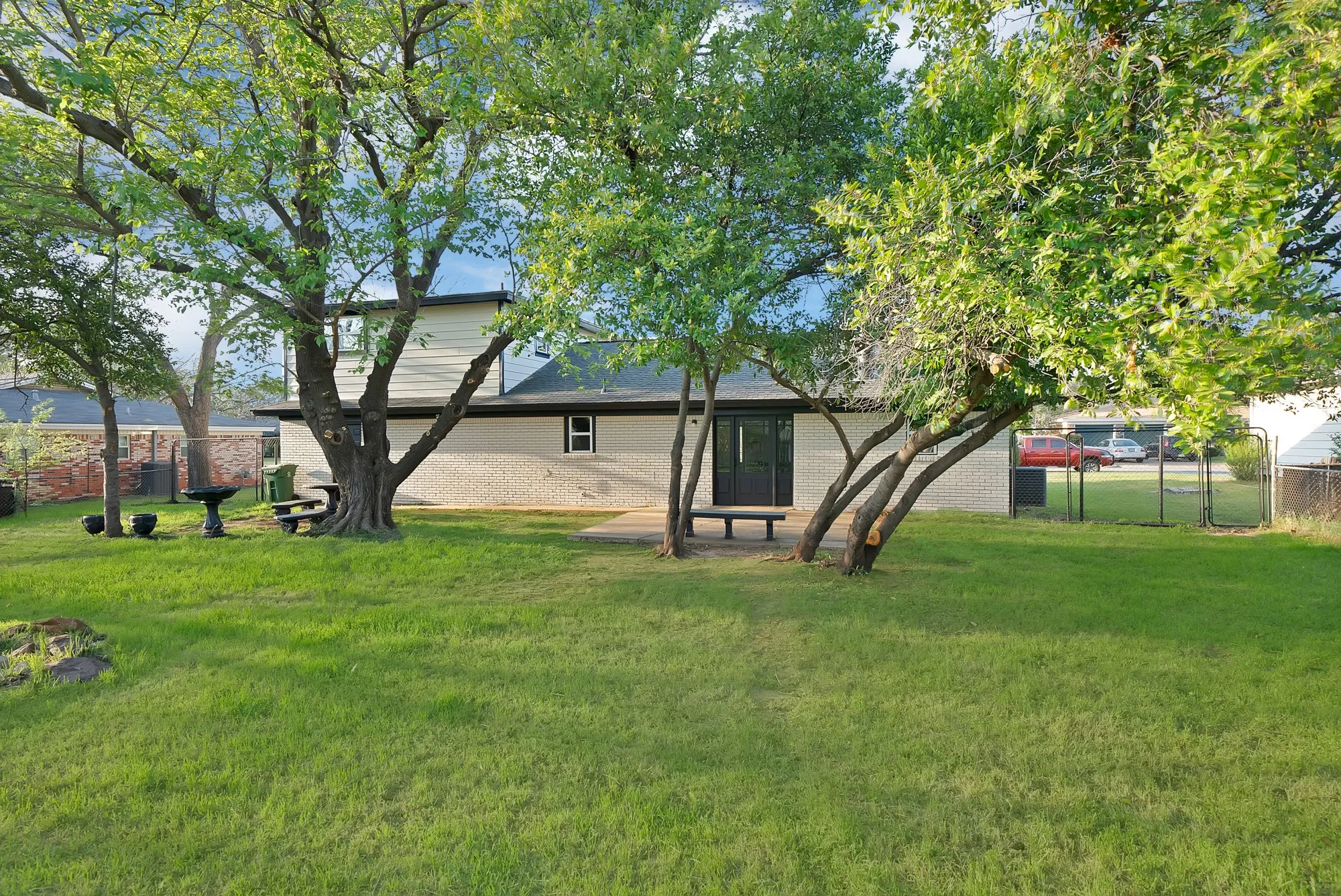 Rear view of house with brick siding