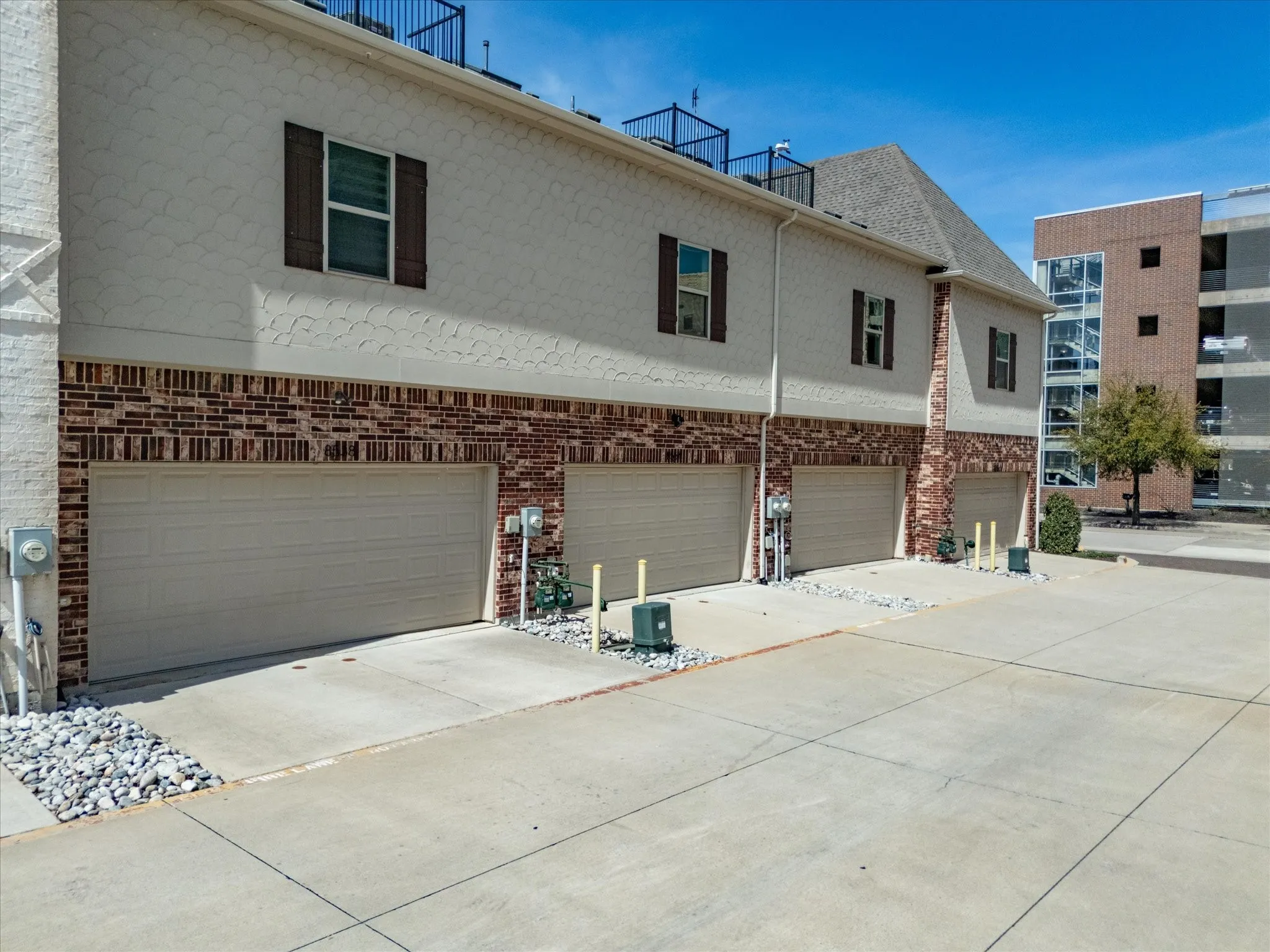View of rear entry garage and concrete road