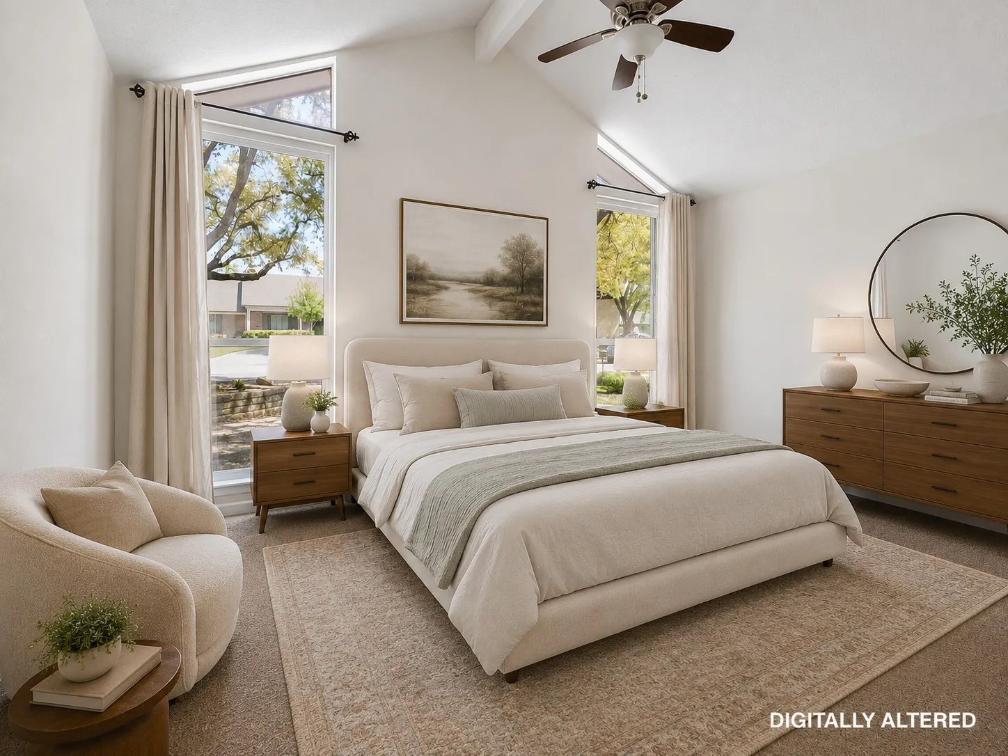 Vaulted ceiling with a ceiling fan, two tall windows with upper transom windows, and neutral carpeting