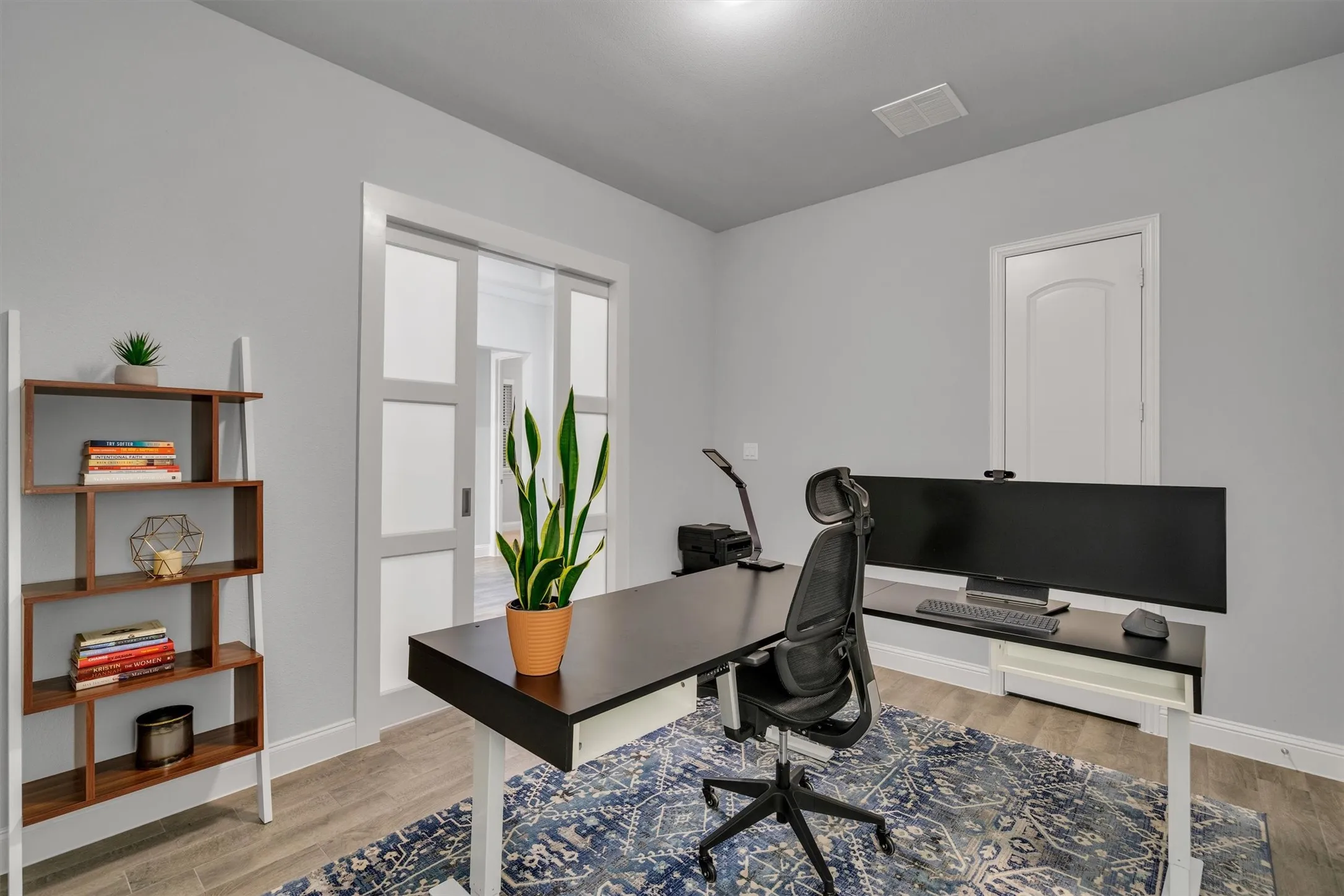 forth bedroom with walk-in closet and pocket doors