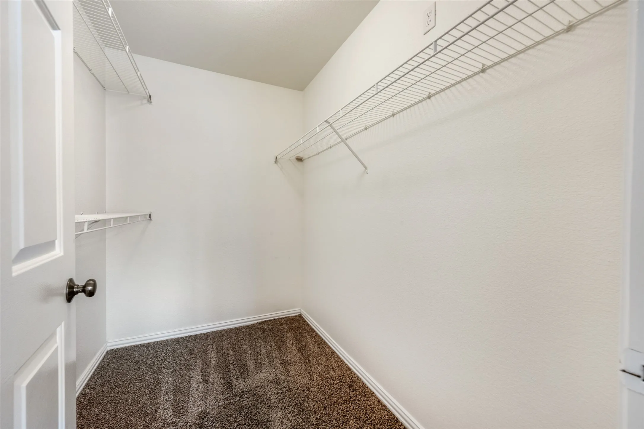 Plenty of storage in master closet