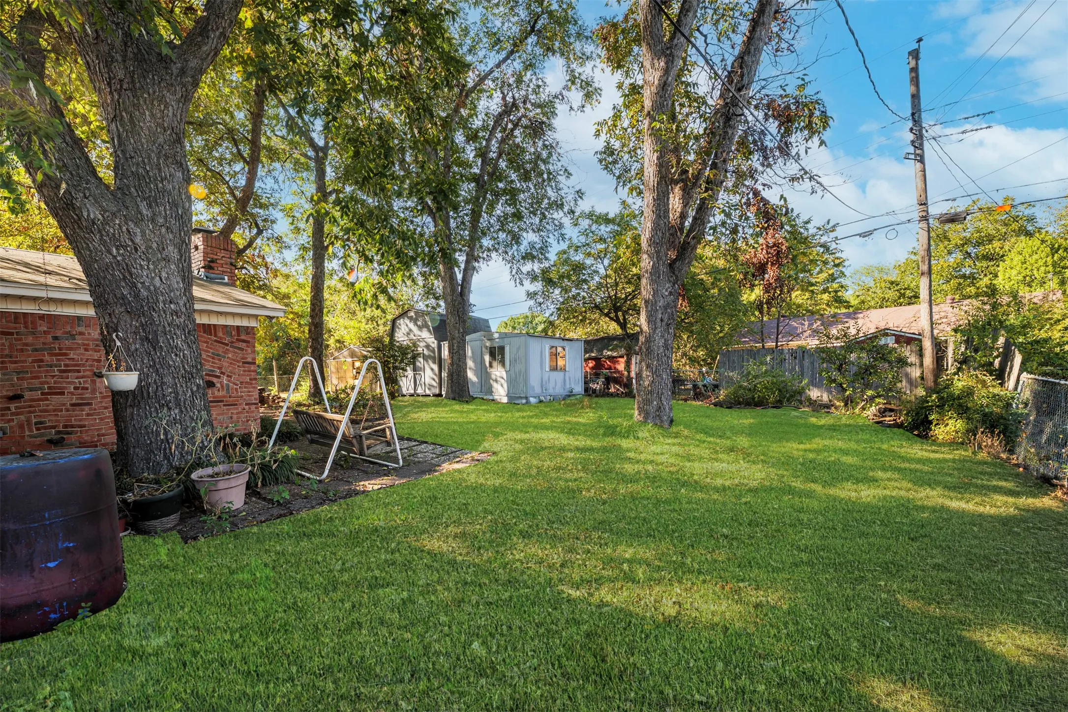 Fenced backyard with a shed