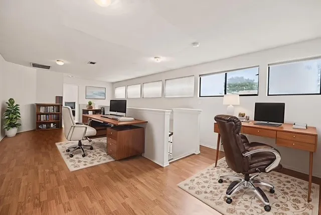 Office with light wood-type flooring