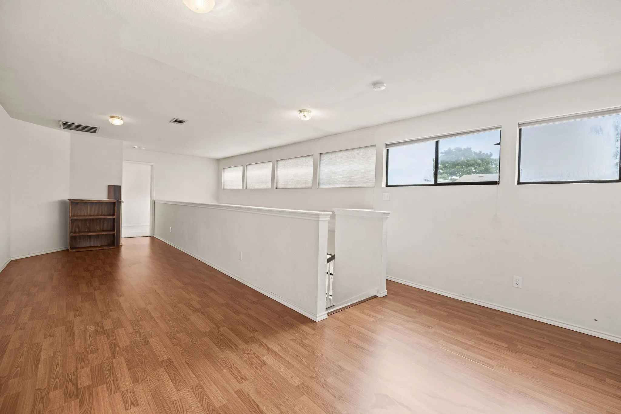 Basement with wood finished floors and​​‌​​​​‌​​‌‌​‌‌​​​‌‌​‌​‌​‌​​​‌​​ baseboards
