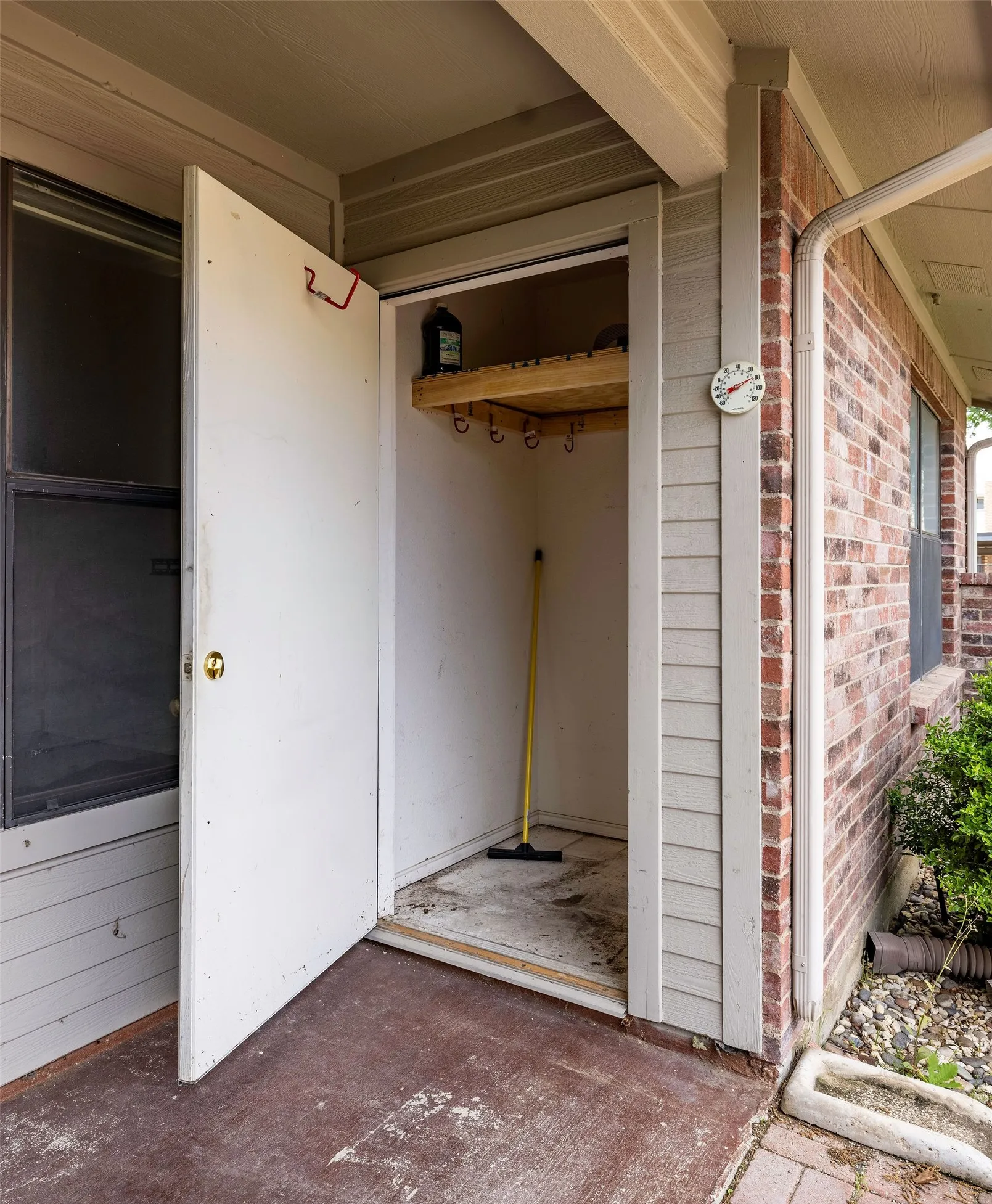 Property entrance with brick siding