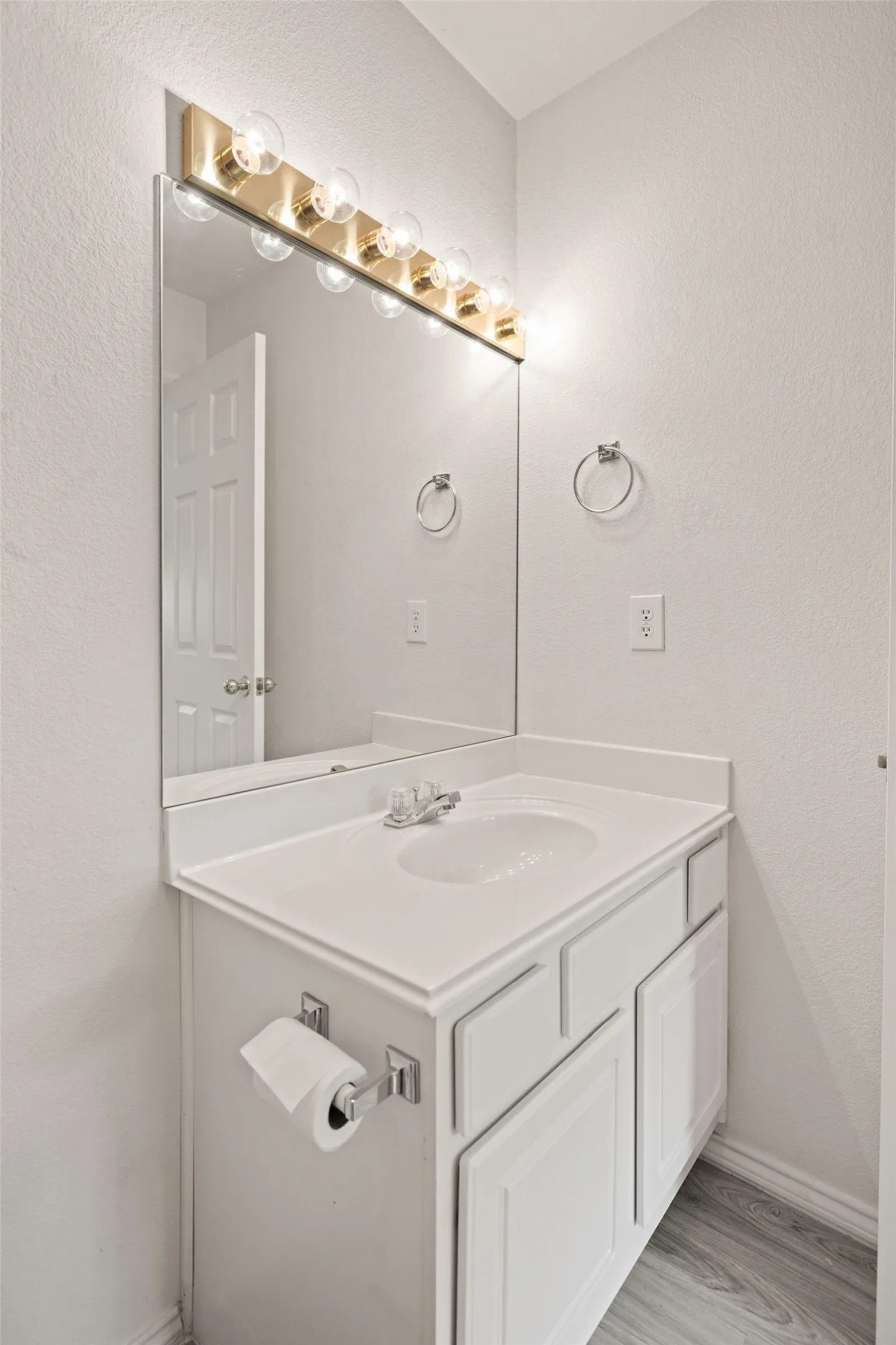 Bathroom featuring vanity and baseboards