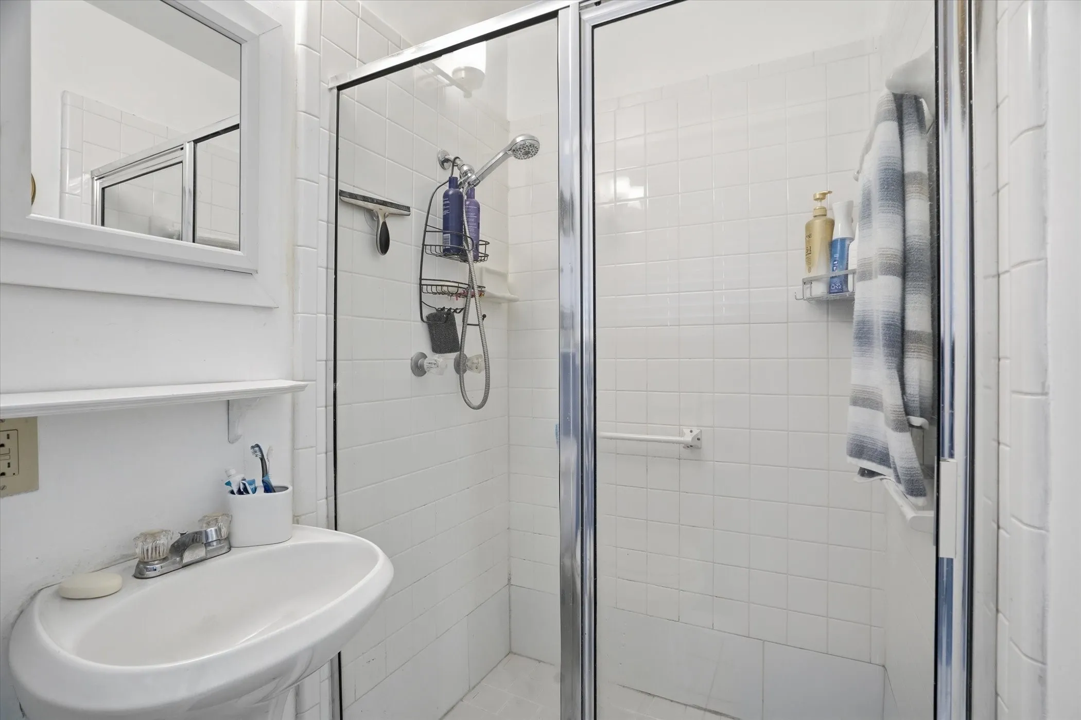 Full bath with a shower stall