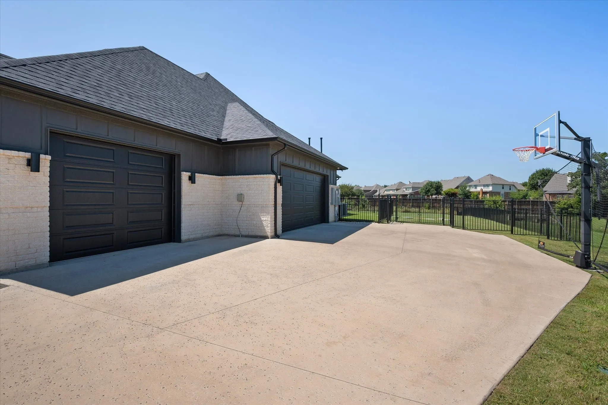 Extended driveway offers additional parking.