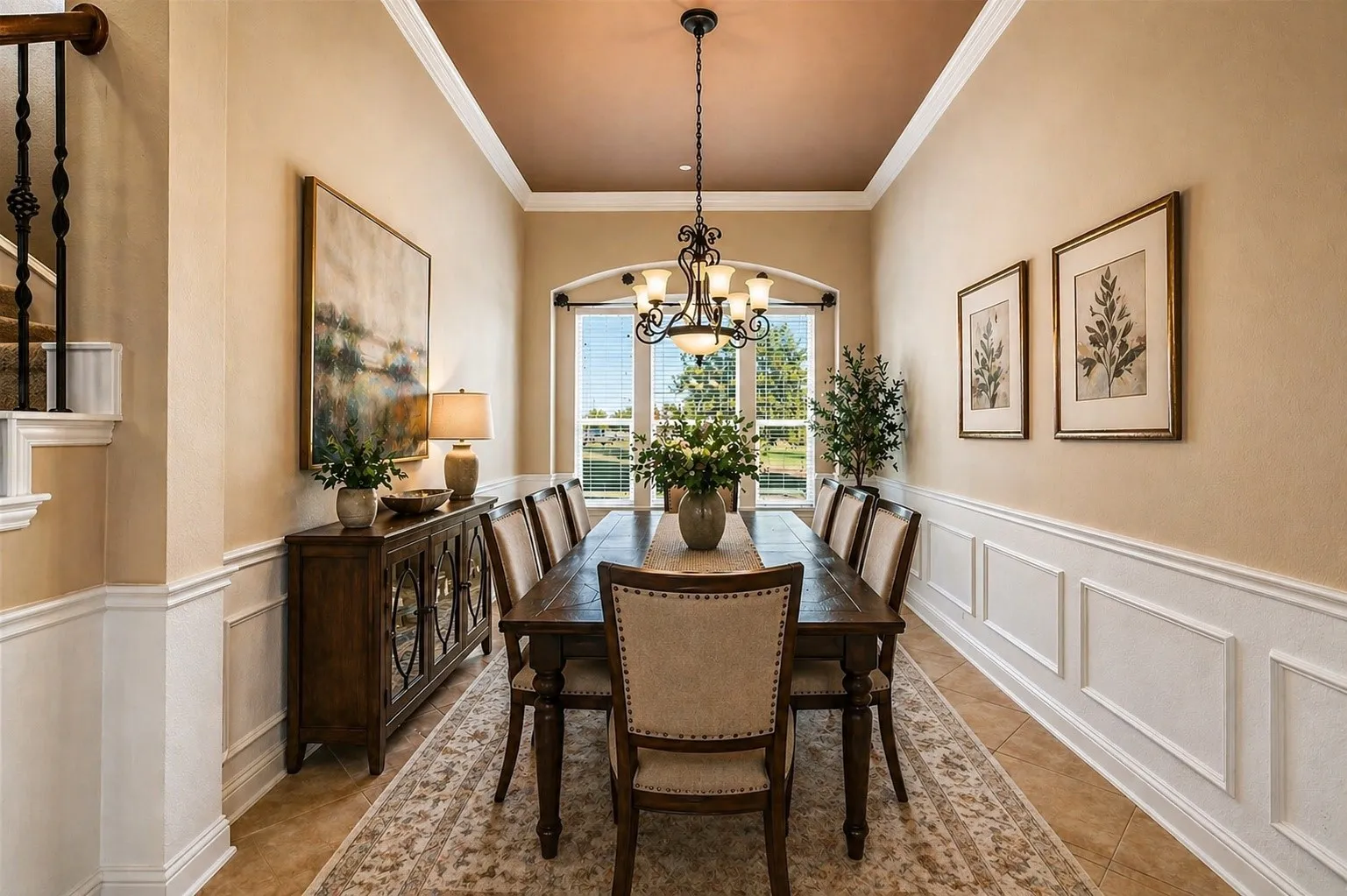 Virtually Staged Recessed tray ceiling with crown molding and chandelier, framed by arched window with exterior views
