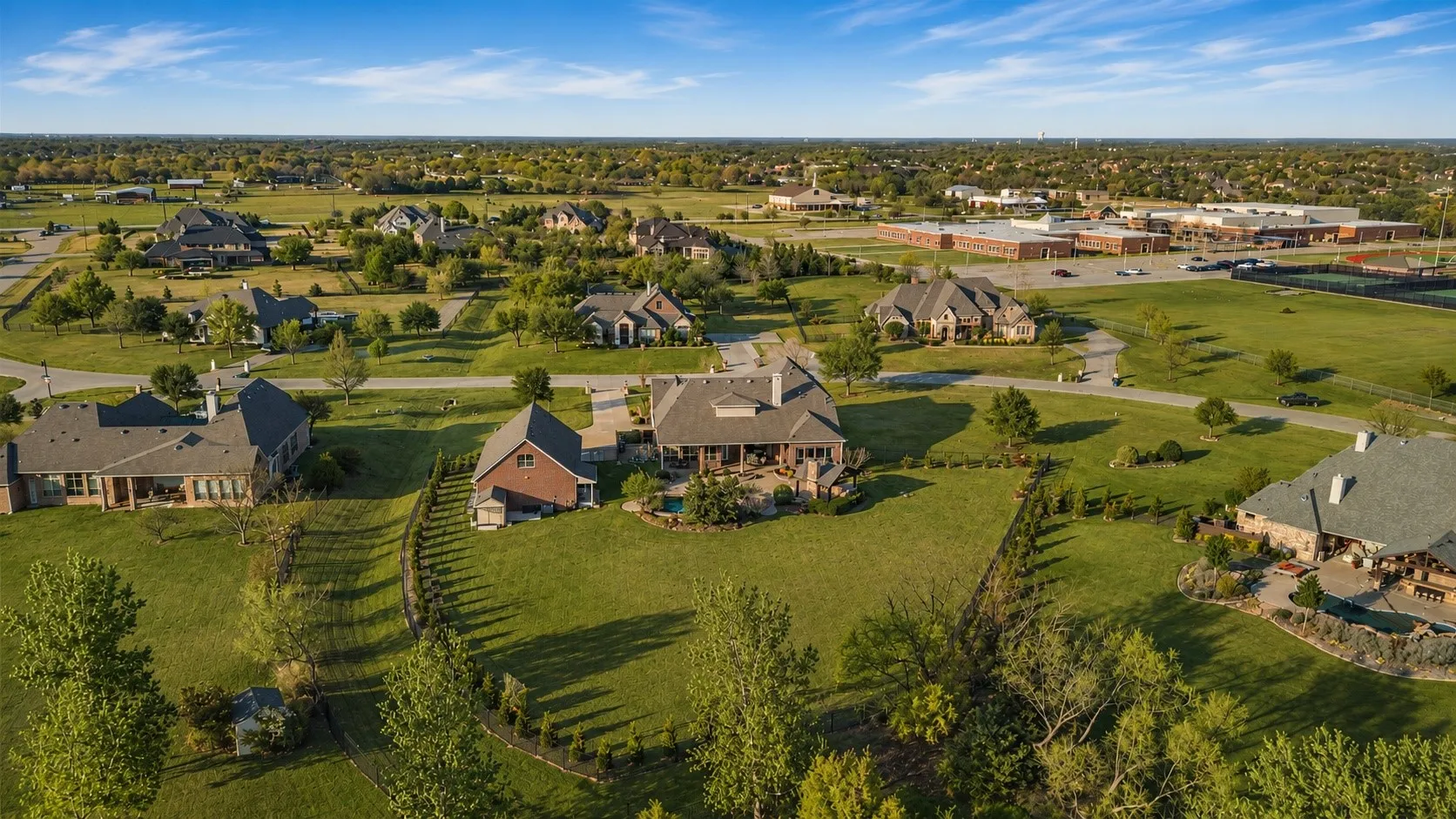 Expansive suburban landscape featuring multiple residences on large lots