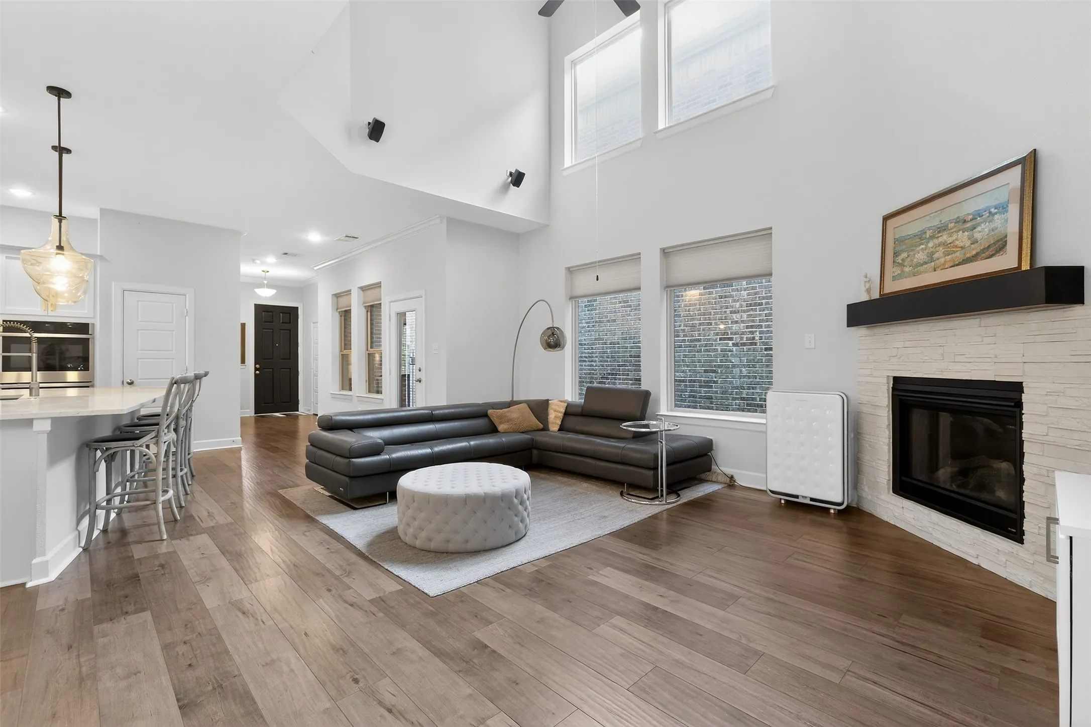 Dining room featuring hanging lights and dark wood-style floors