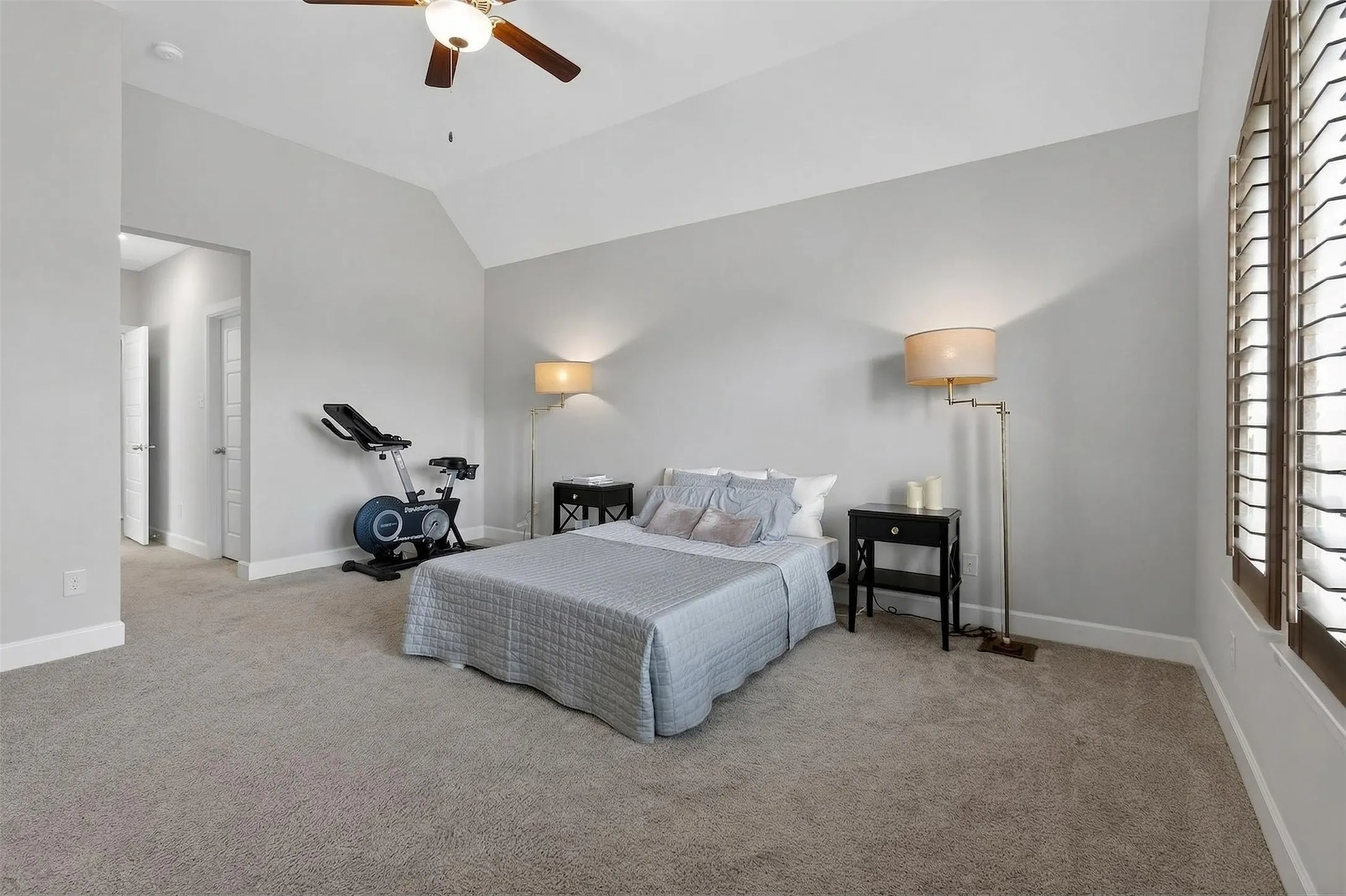 Full bathroom featuring double vanity, a shower stall, a garden tub, and a spacious closet