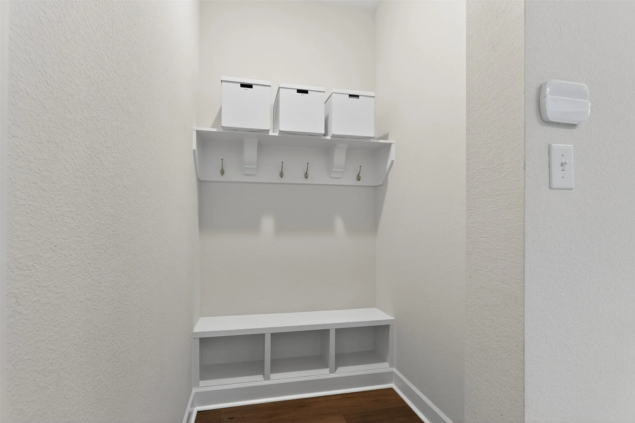 Living area with light carpet and attic access